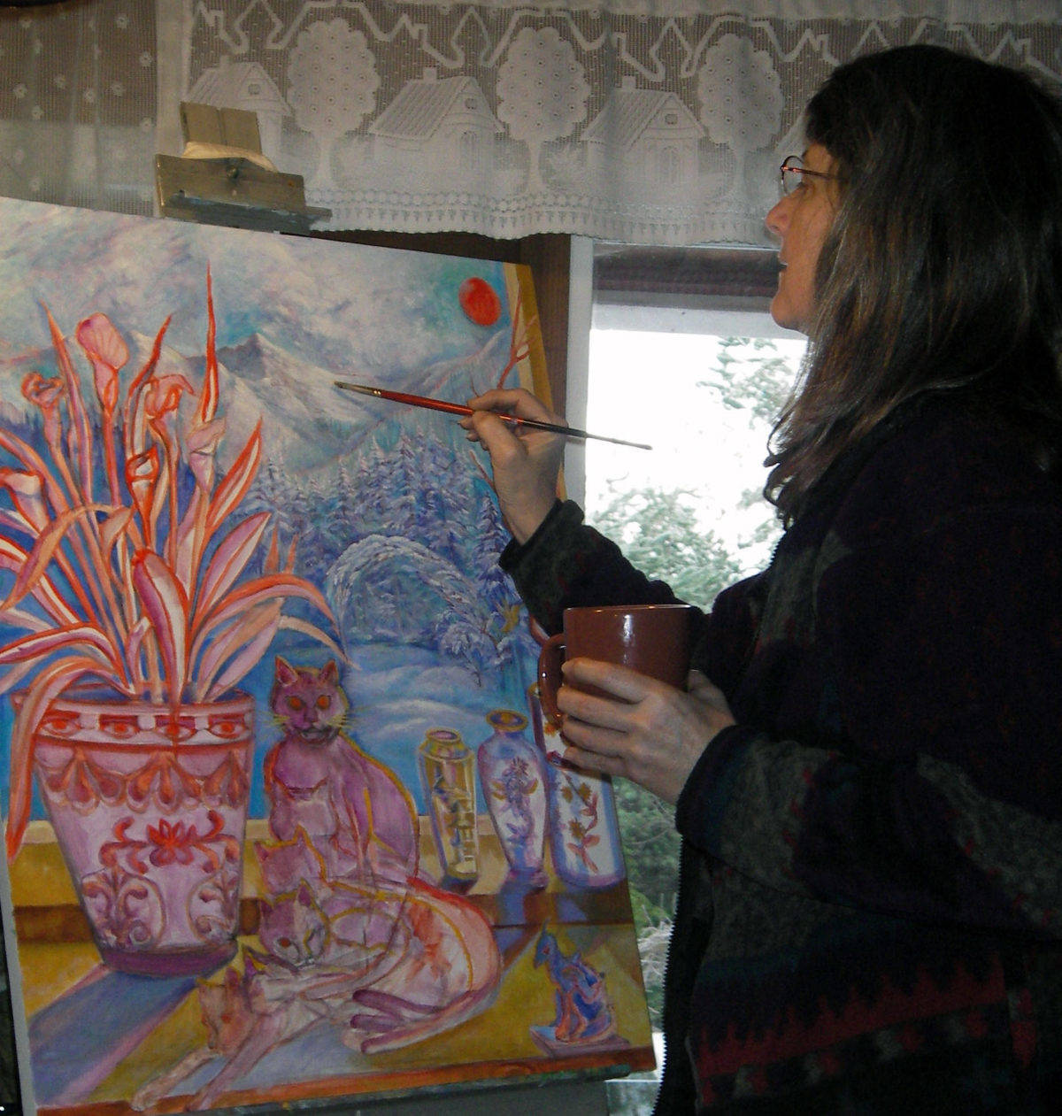 Dianne Anderson paints a picture of a cat. The Juneau artist, who sometimes creates commissioned pieces of pets, has lived, taught and painted in Juneau since the mid-1980s, however, she is planning to retire from the professional arts community and move to Washington by 2020. (Courtesy Photo | Mark Vinsel)
