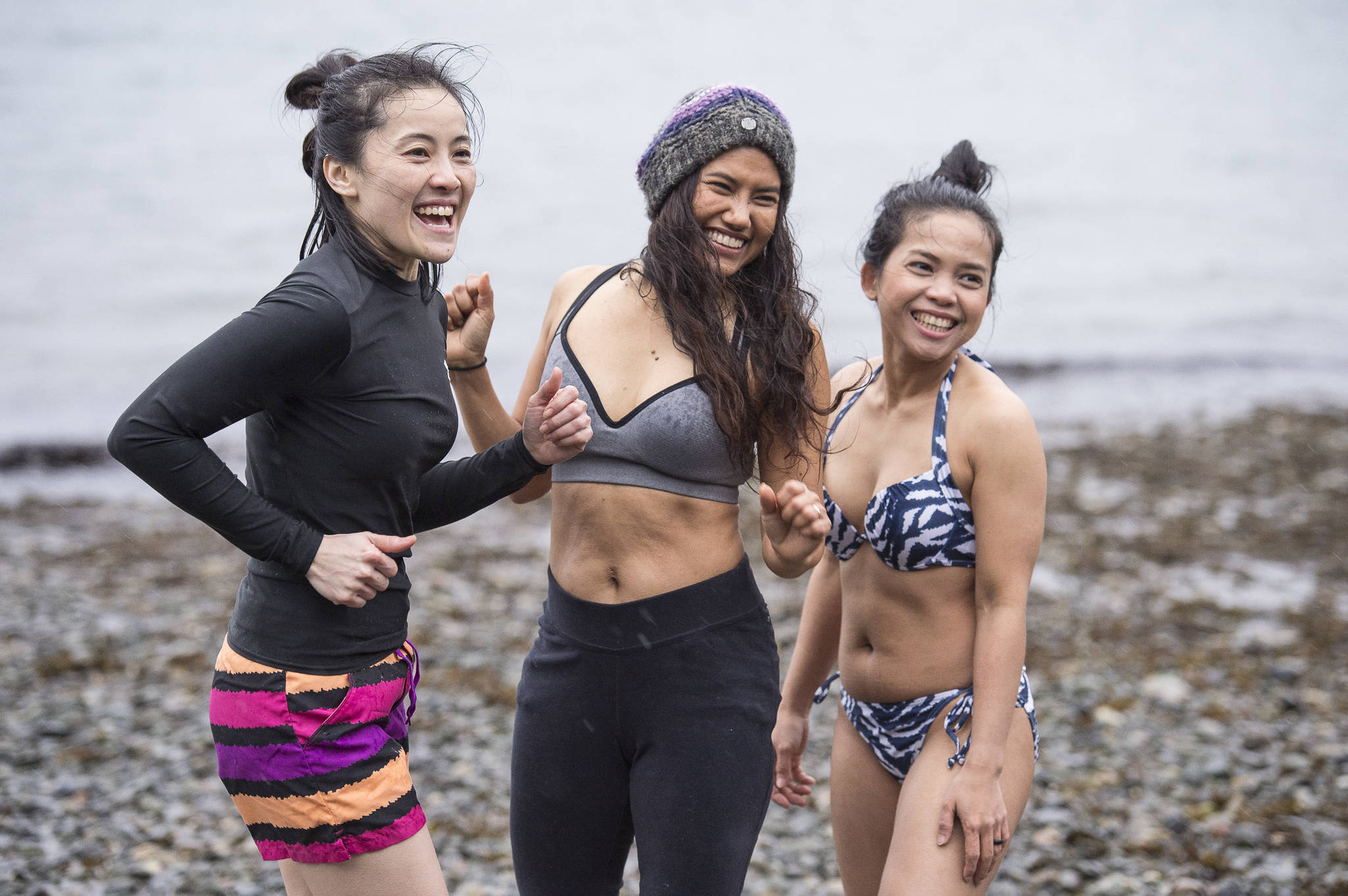 Juneau residents prepare themselves for the annual Juneau Polar Bear Dip at Auke Bay Recreation Area on Tuesday, Jan. 1, 2019. Nearly 200 people took the plunge to start off the new year. (Michael Penn | Juneau Empire)