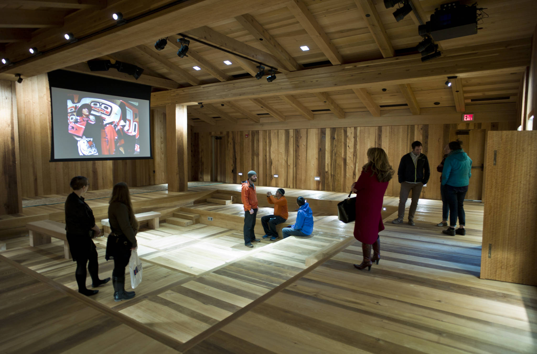 Guests view the Clan House inside the new Walter Soboleff Center and home of the Sealaska Heritage Institute during a Sneak Peak event held on Thursday. (Michael Penn | Juneau Empire File)