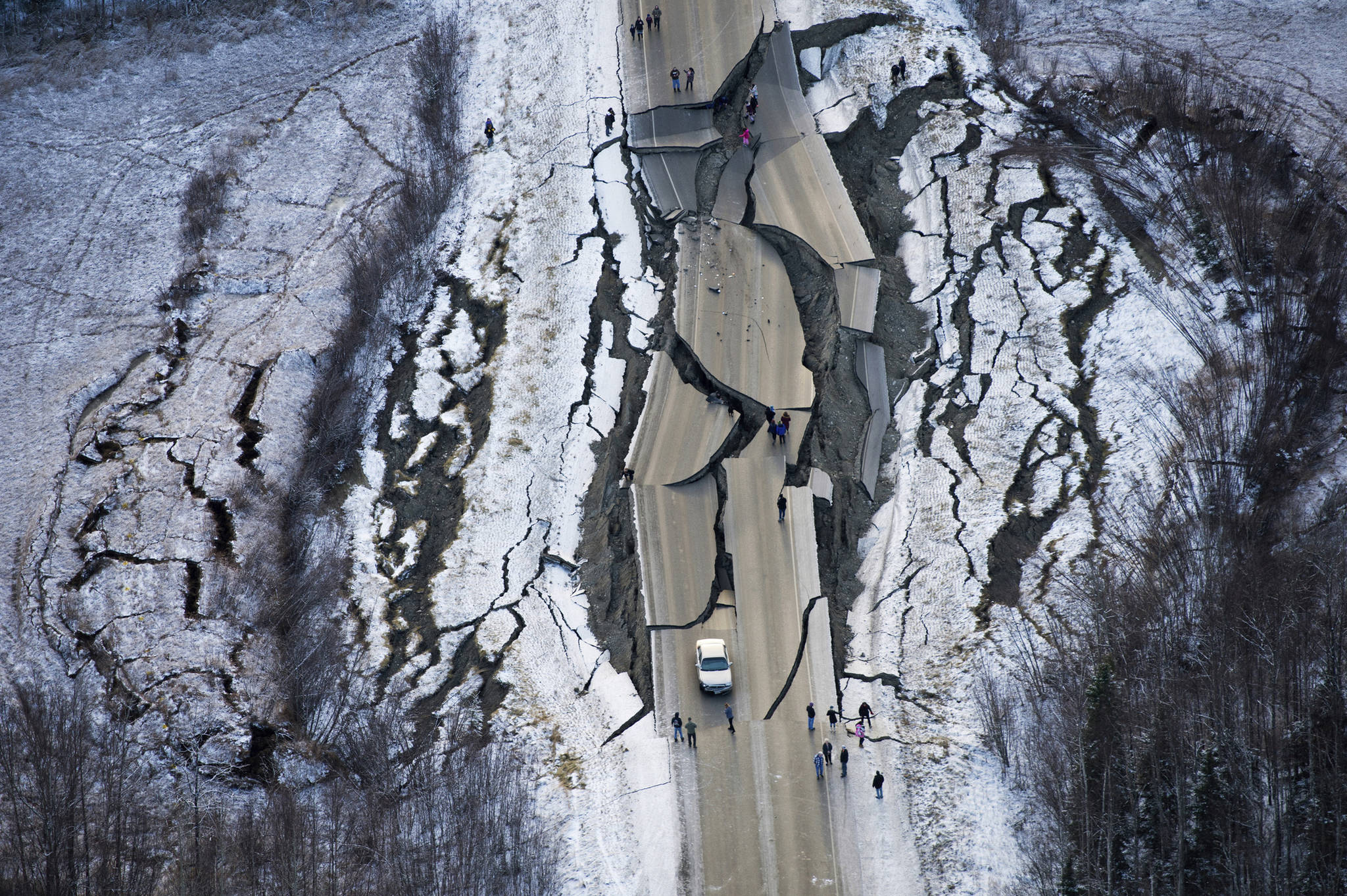 This Nov. 30, 2018 photo shows earthquake damage on Vine Road, south of Wasilla, Alaska. (Marc Lester | Anchorage Daily News via the Associated Press)