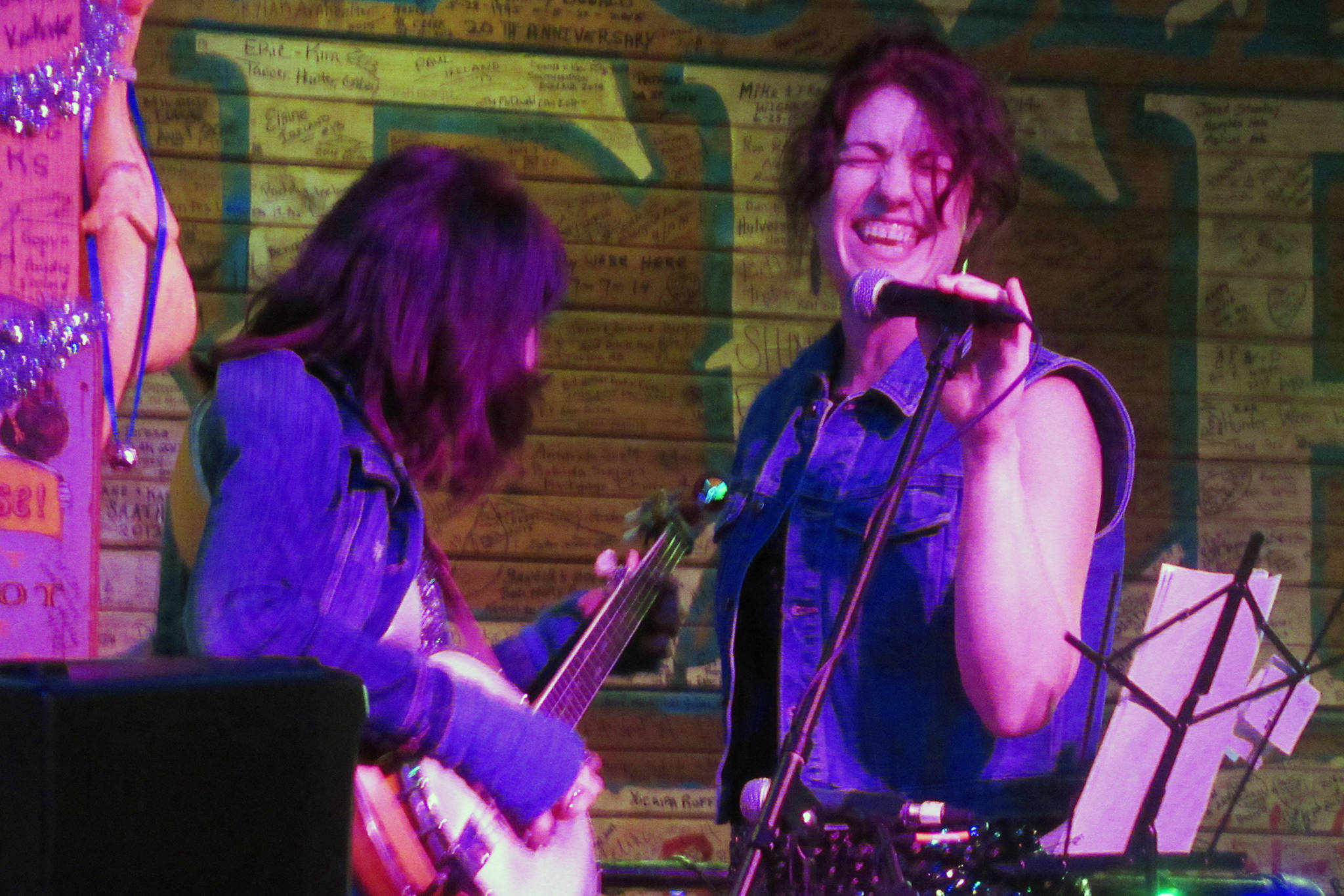 Wendy Hladick plays banjo while Rashah McChesney sings during the Sand Witches’ set Friday, Jan. 4, 2019 at the Red Dog Saloon. (Ben Hohenstatt | Capital City Weekly)