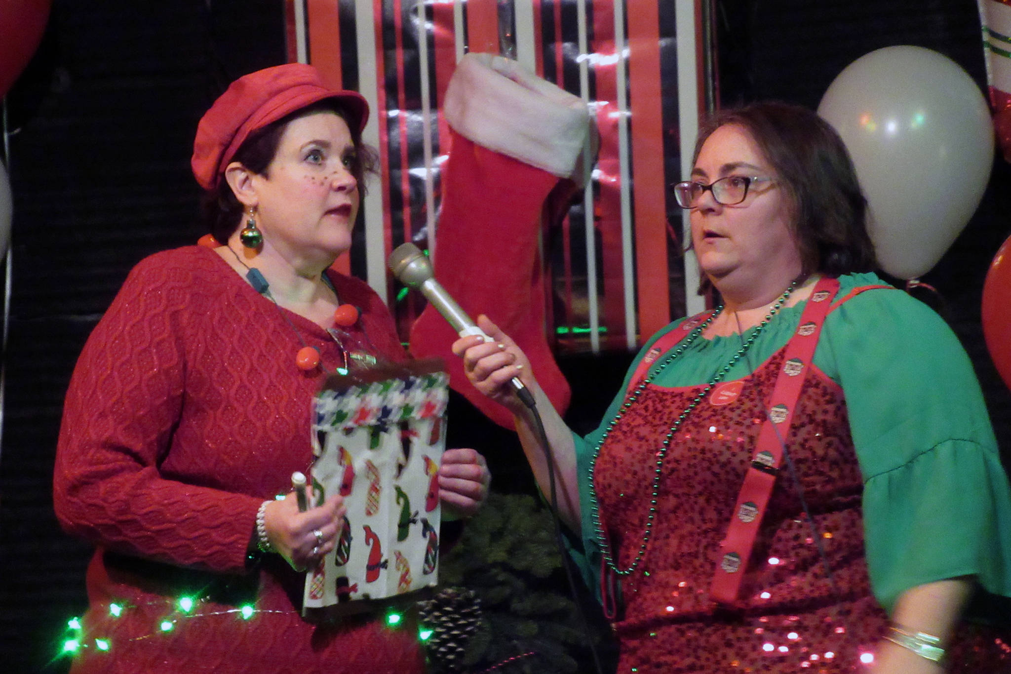 Amy Dressel talks to boss elf Collette Costa about how they’re going to bail reindeer out of jail during a slightly belated Christmas extravaganza at the Gold Town Theater Saturday, Jan. 5, 2019. (Ben Hohenstatt | Capital City Weekly)