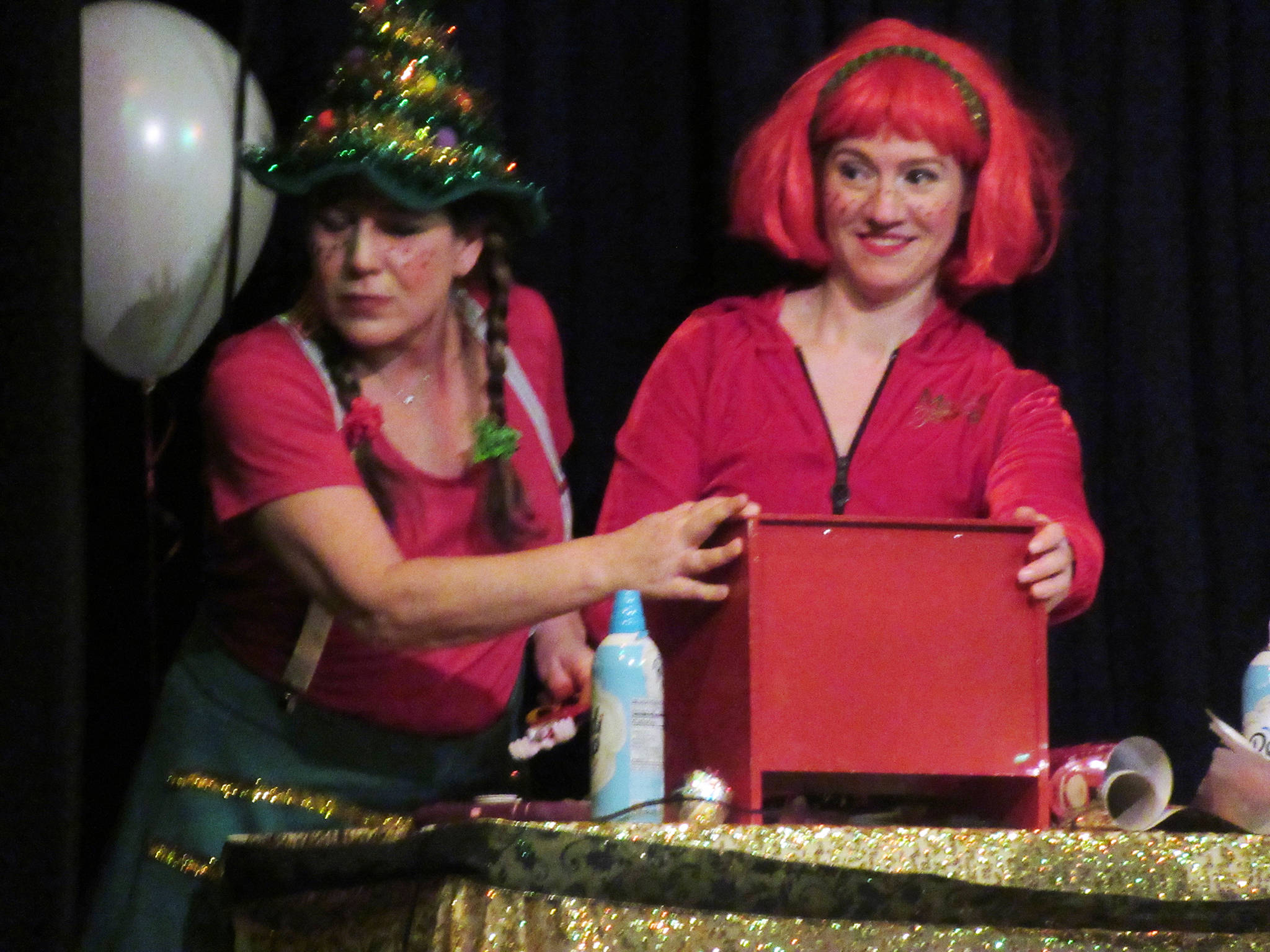 Elves Lisa Morley and Alysia Jones react to the news that they must always be tinkering during the Christmas extravaganza at the Gold Town Theater Saturday, Jan. 5, 2019. (Ben Hohenstatt | Capital City Weekly)