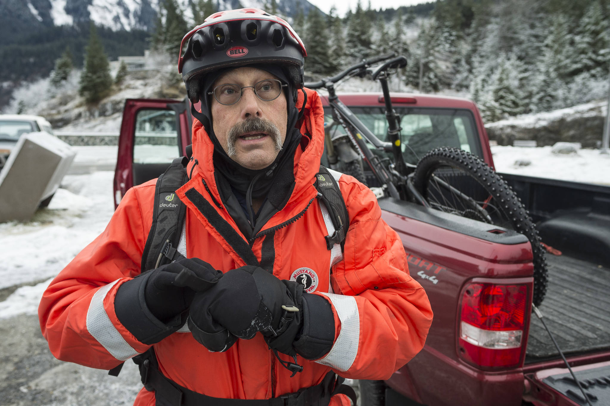 Bob Funk retells his story on Monday, Jan. 7, 2019, of falling through thin ice while riding his bicycle on Mendenhall Lake near the face of the Mendenhall Glacier on Sunday. He was rescued by a skater who was carrying a throw rope. Funk said, “I went in and I think adrenaline took care of the first initial cold impact. I was busy working to get up on the ice and when I would it would break out from under me. I don’t know if I had enough in the tank to get myself out.” (Michael Penn | Juneau Empire)