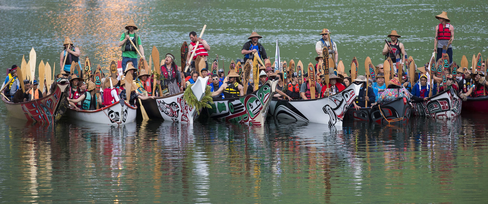 Canoes from around Southeast Alaska and Canada arrive at the Mike Pusich Douglas Harbor to participate in a Welcoming Ashore ceremony on Tuesday, June 5, 2018. The event, sponsored by the One People Canoe Society, is the unofficial start of Celebration 2018. (Michael Penn | Juneau Empire)