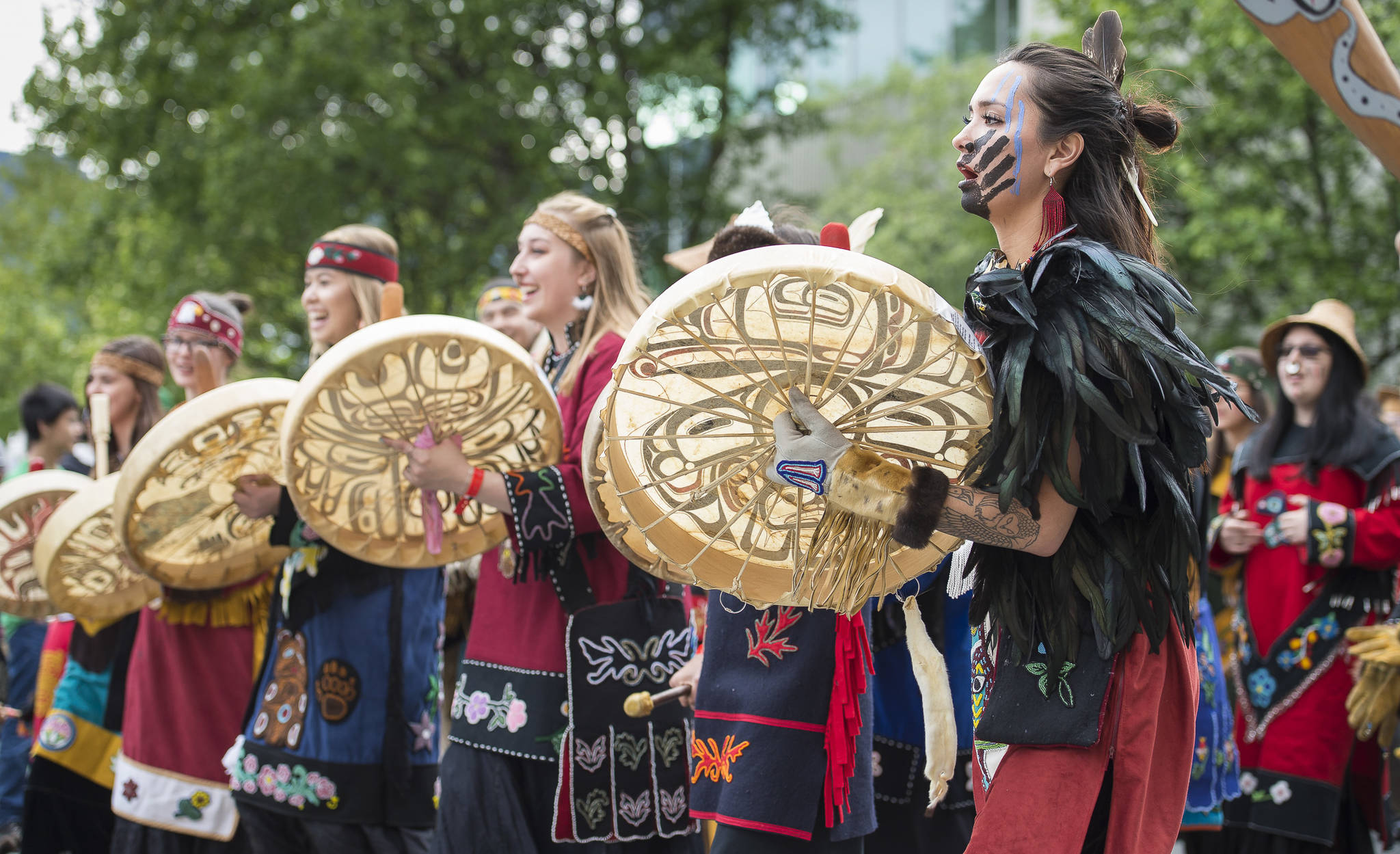 Members of the Mount Saint Elias Dancers of Yakutat parade in the Grand Entrance for Celebration 2018 along Willoughby Avenue on Wednesday, June 6, 2018. (Michael Penn | Juneau Empire)