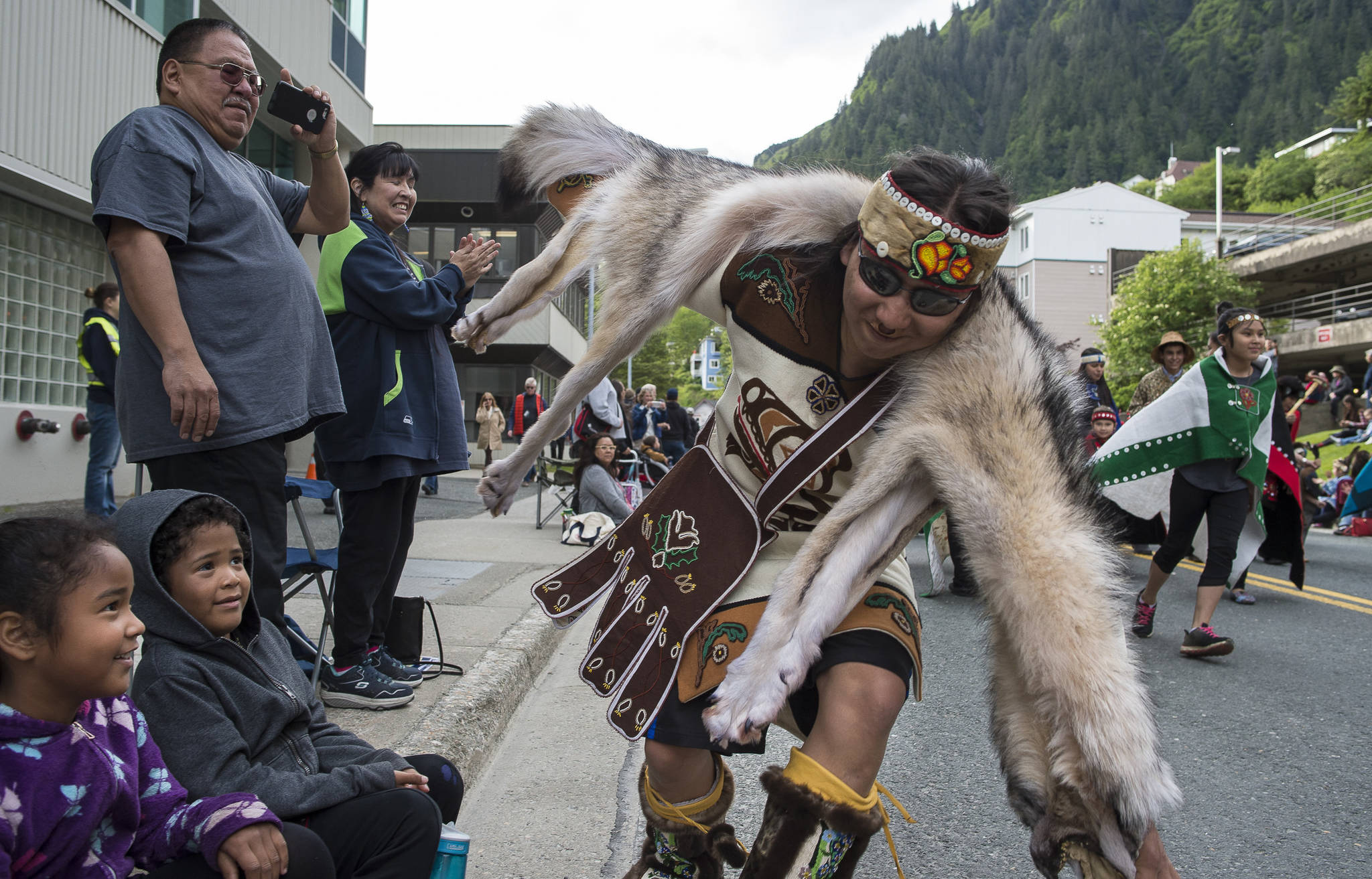 Morgan Fawcett of Woosh.ji.een of Juneau dances in the Grand Entrance for Celebration 2018 along Willoughby Avenue on Wednesday, June 6, 2018. (Michael Penn | Juneau Empire)