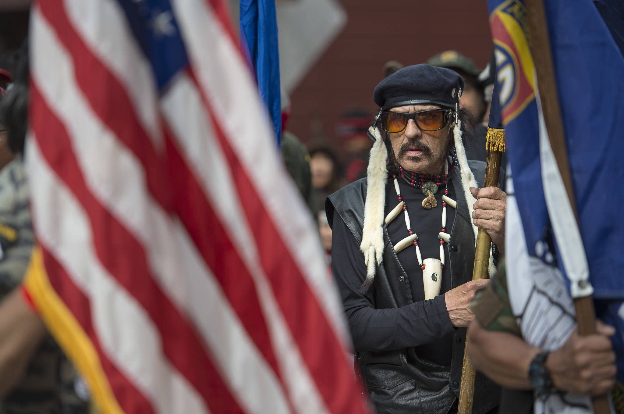 Wayne Smallwood lines up with the Southeast Alaska Native Veterans honor guard to lead dance groups parade through downtown Juneau on Saturday, June 9, 2018, the last day of Celebration 2018. (Michael Penn | Juneau Empire)