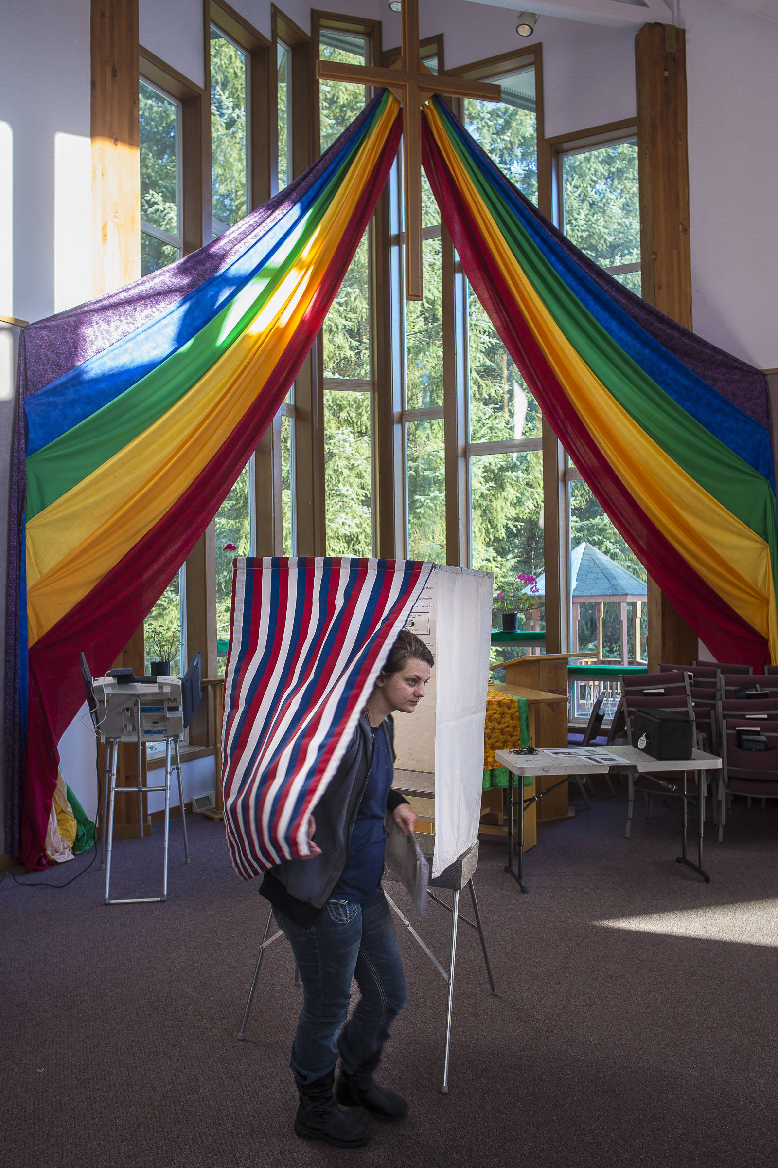 Maisi MacCabe exits a voting booth at Aldersgate United Methodist Church on Election Day, Tuesday, Nov. 6, 2018. (Michael Penn | Juneau Empire)