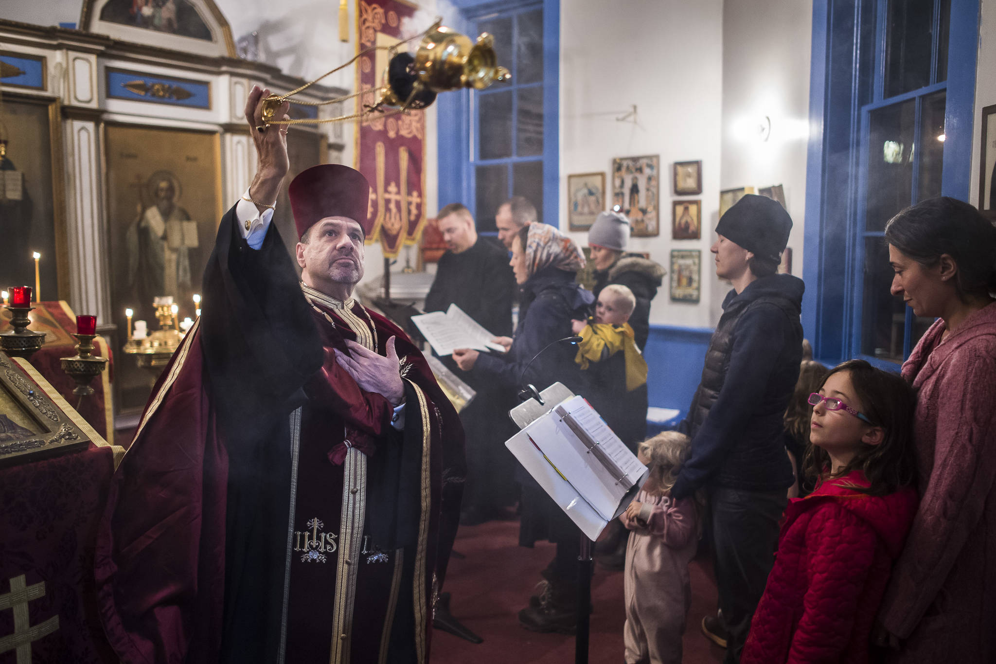 Rev. Steven F. McGuigan, Rector of the St. Nicholas Russian Orthodox Church, performs a Festal Vespers service to celebrate on the eve of Saint Nicholas Day on Wednesday, Dec. 5, 2018. The Cathedral of the Nativity of the Blessed Virgin Mary hosted a recepton for the congregation in St. Ann’s Parish Hall after the service. (Michael Penn | Juneau Empire)