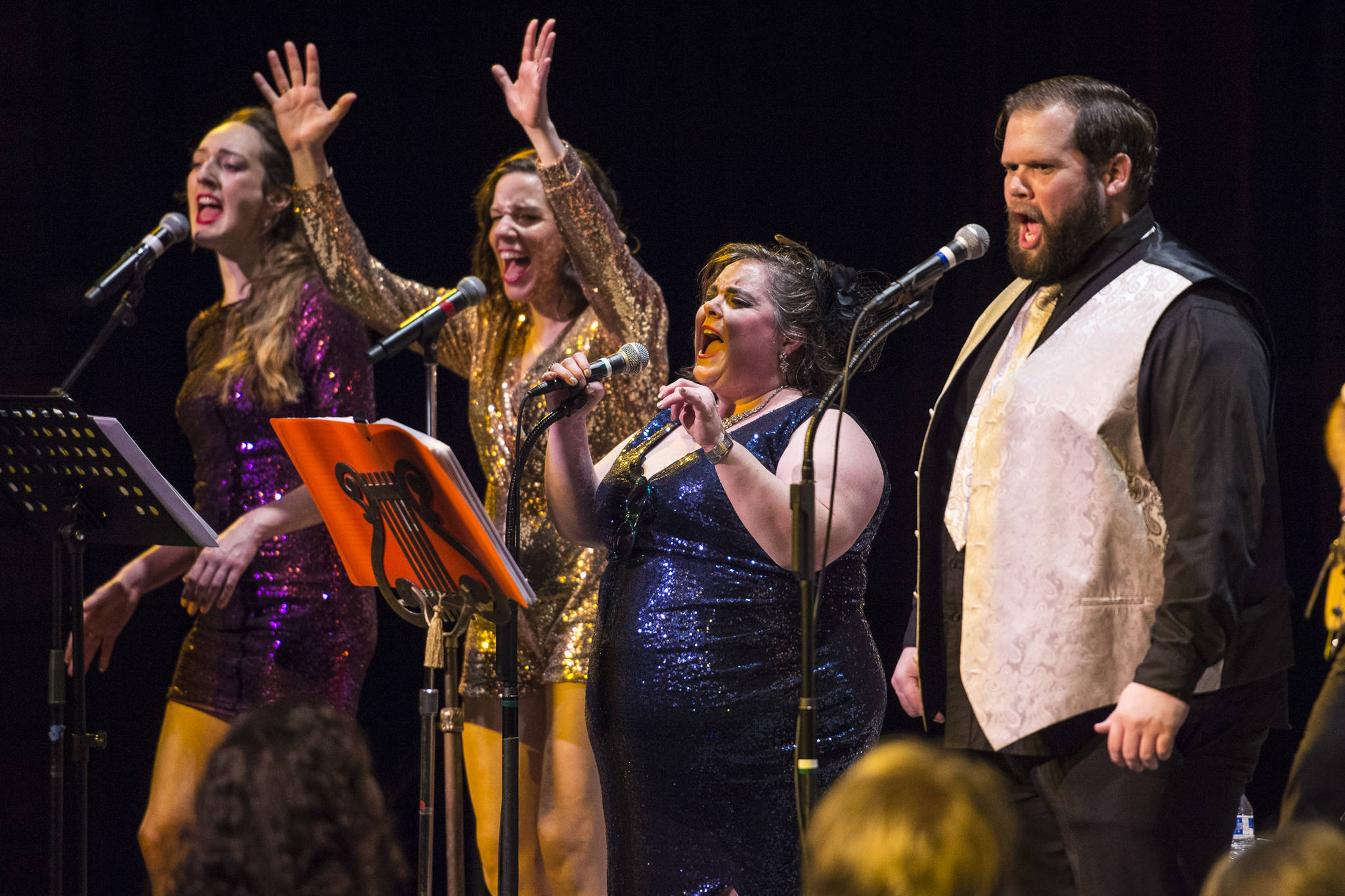 Taylor Vidic, left, Allison Holtkamp, Collette Costa, Mike Gamble, right, perform as Gamble & High Costa Livin’ during the New Year’s Eve Gala at Centennial Hall on Monday, Dec. 31, 2018. The event was a fundraiser for the Juneau Arts and Humanities Council and Juneau Jazz & Classics. (Michael Penn | Juneau Empire)