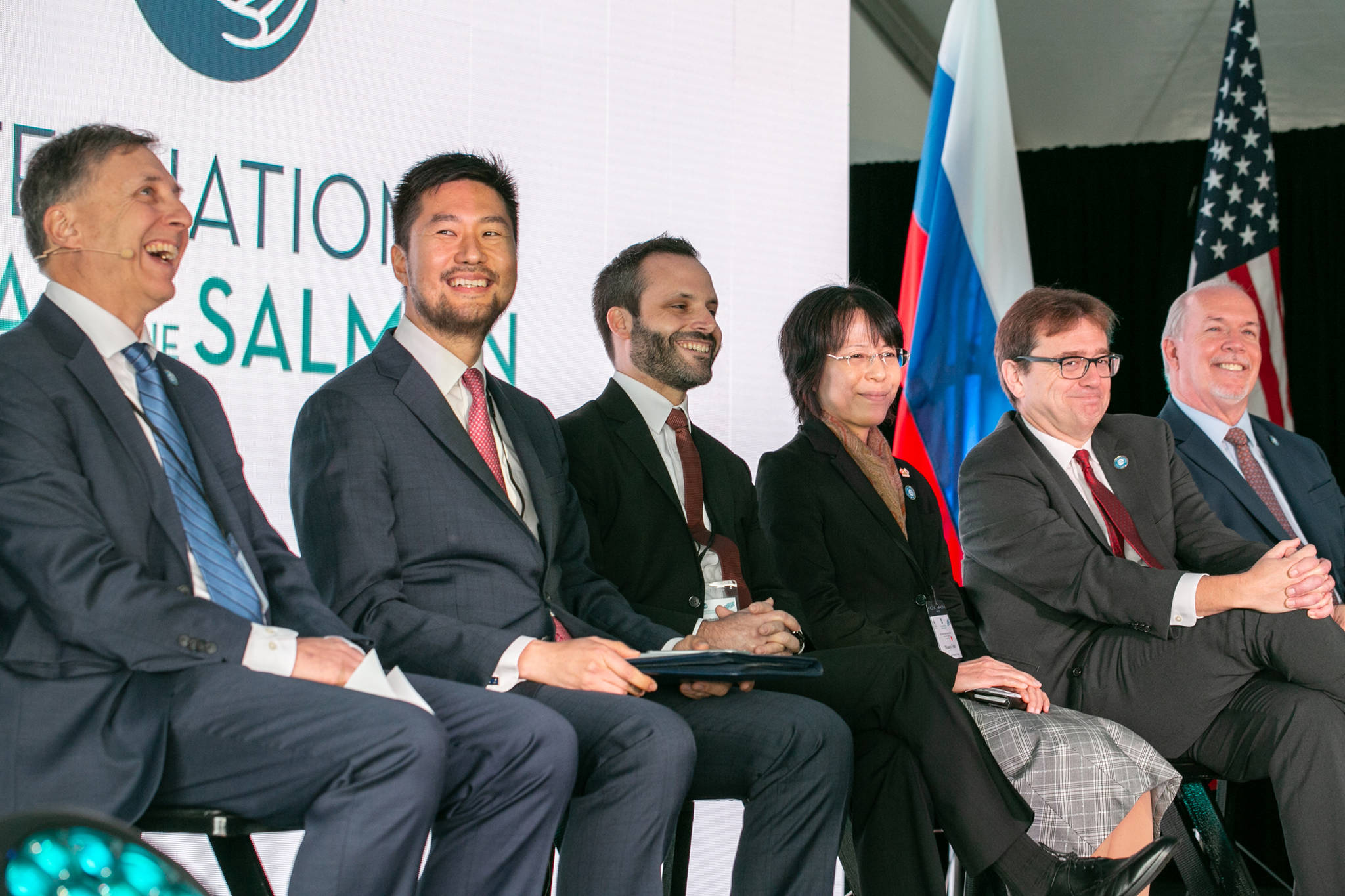 Dignitaries of the North Pacific Anadromous Fish Commission member countries laugh during the launch of the International Year of the Salmon in October 2018 in Vancouver, British Columbia. (Courtesy Photo)