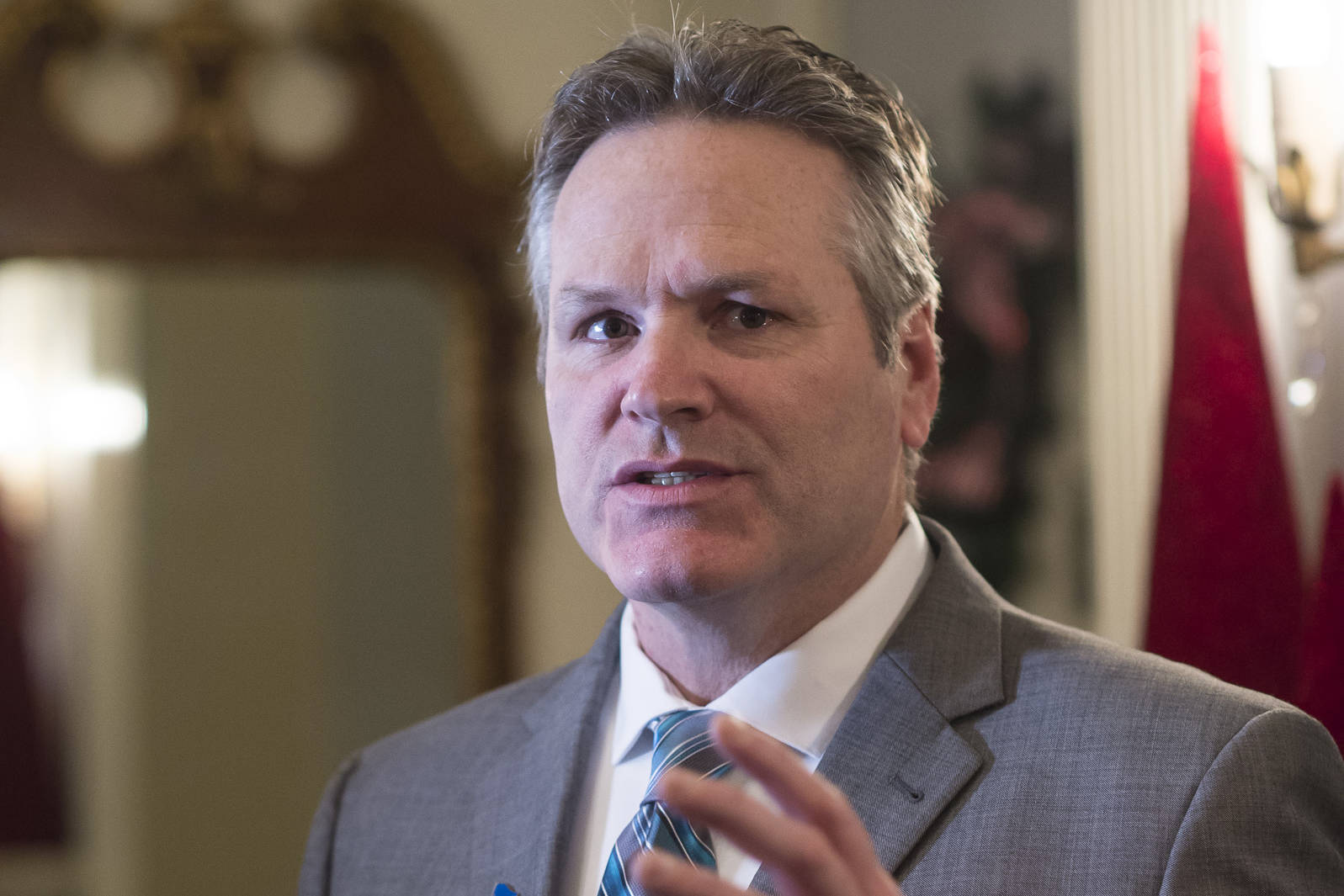 Gov. Mike Dunleavy speaks to members of the media before welcoming Juneau residents to the Governors Open House on Tuesday, Dec. 11, 2018. (Michael Penn | Juneau Empire)