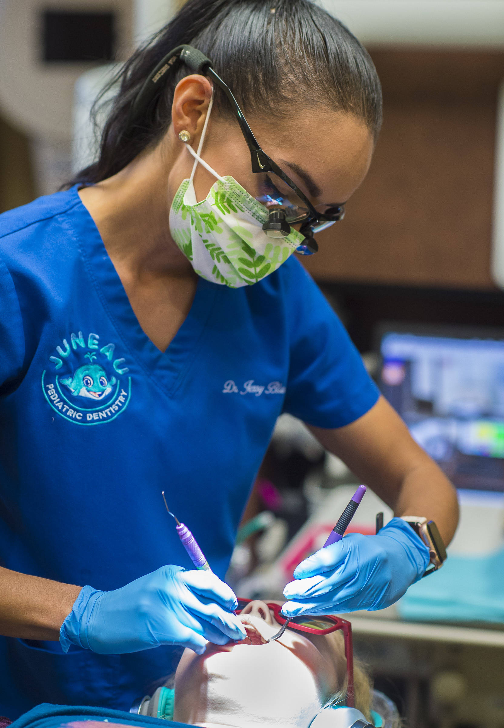 Dr. Jessica Blanco, of Juneau Pediatric Dentistry, provides a checkup on Tynly Booth, 8, on Monday, Jan. 14, 2019. Tynly was given a topical fluoride varnish as part of her checkup. (Michael Penn | Juneau Empire)