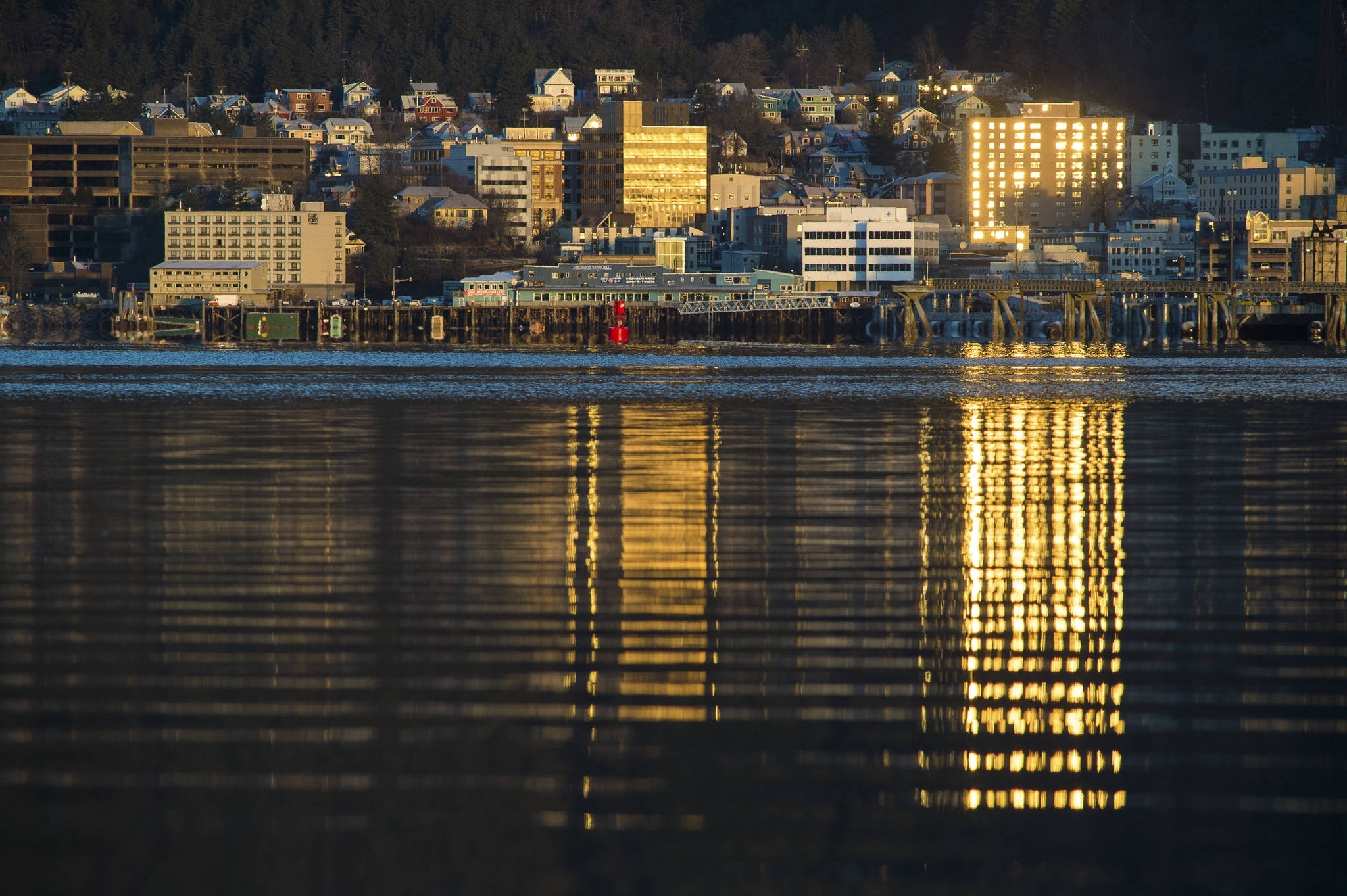The sunrise reflects off of downtown Juneau windows on Friday, Jan. 4, 2019. (Michael Penn | Juneau Empire)