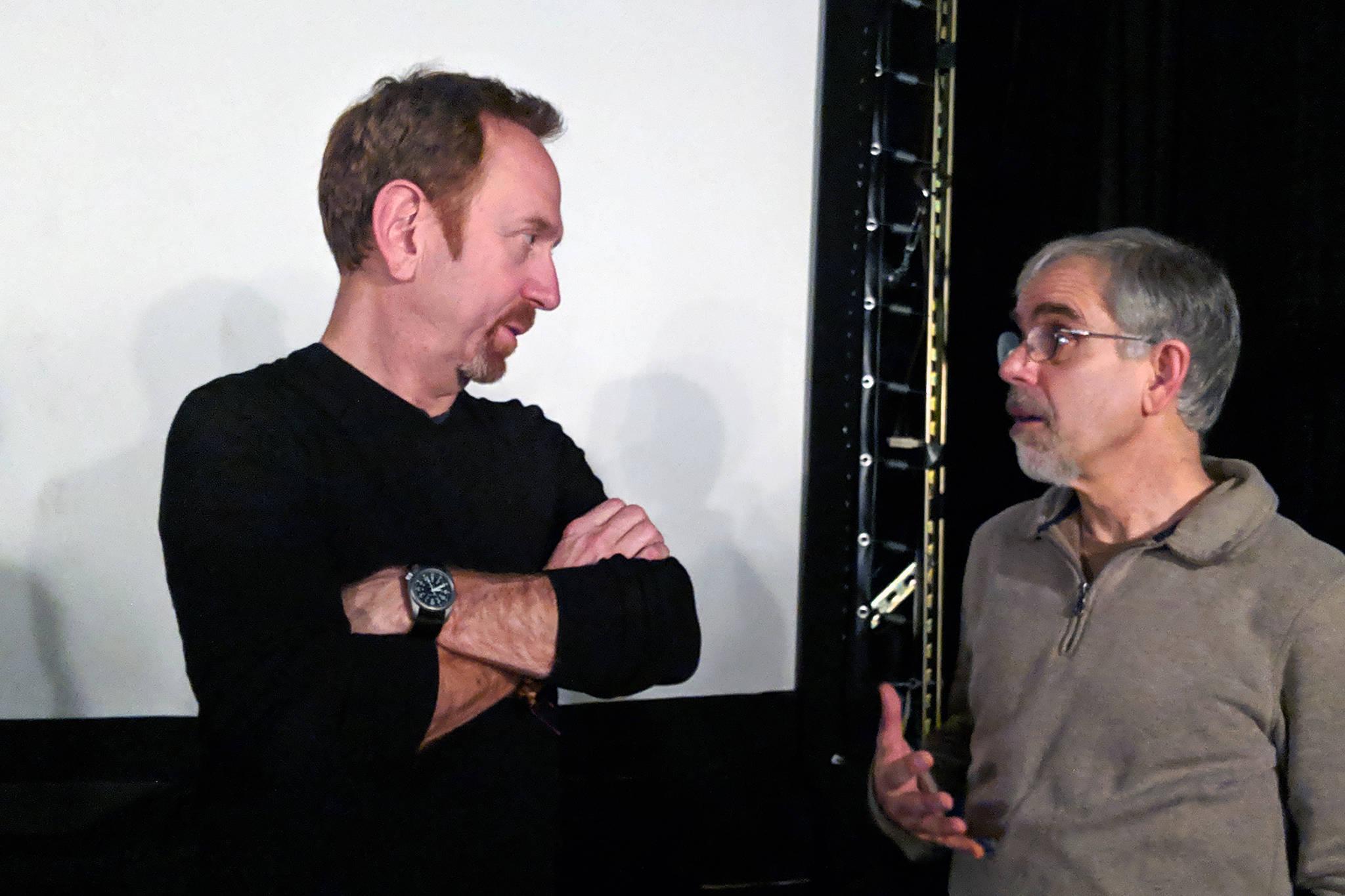 Aaron Davidman, “Wrestling Jerusalem” writer and actor, talks with Rich Moniak of Juneau People for Peace and Justice after a screening of the film, Thursday, Jan. 11, 2019. (Ben Hohenstatt | Capital City Weekly)