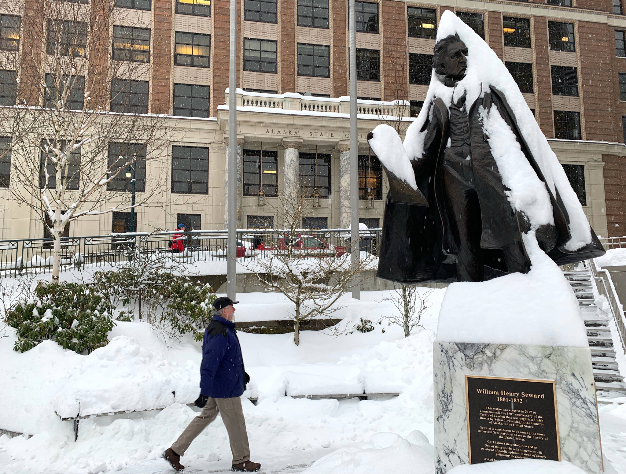 Snow coats the William Henry Seward statue outside of the Alaska State Capitol on Jan. 11, 2019. (Angelo Saggiomo | Juneau Empire)