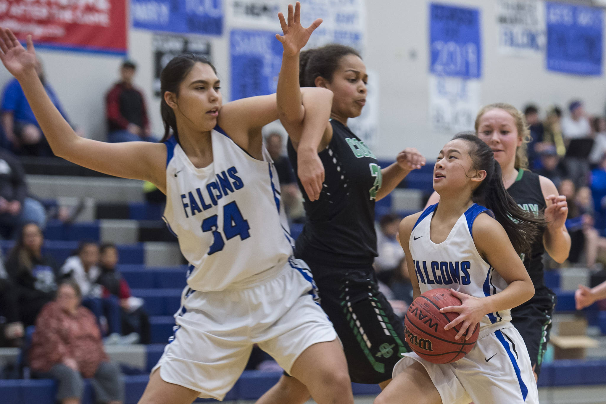 Thunder Mountain’s Mary Khaye Garcia, right, takes advantage of a pick against Colony’s Kali Bull by teammate Kira Frommherz at TMHS on Friday, Jan. 11, 2019. Colony won 58-28. (Michael Penn | Juneau Empire)