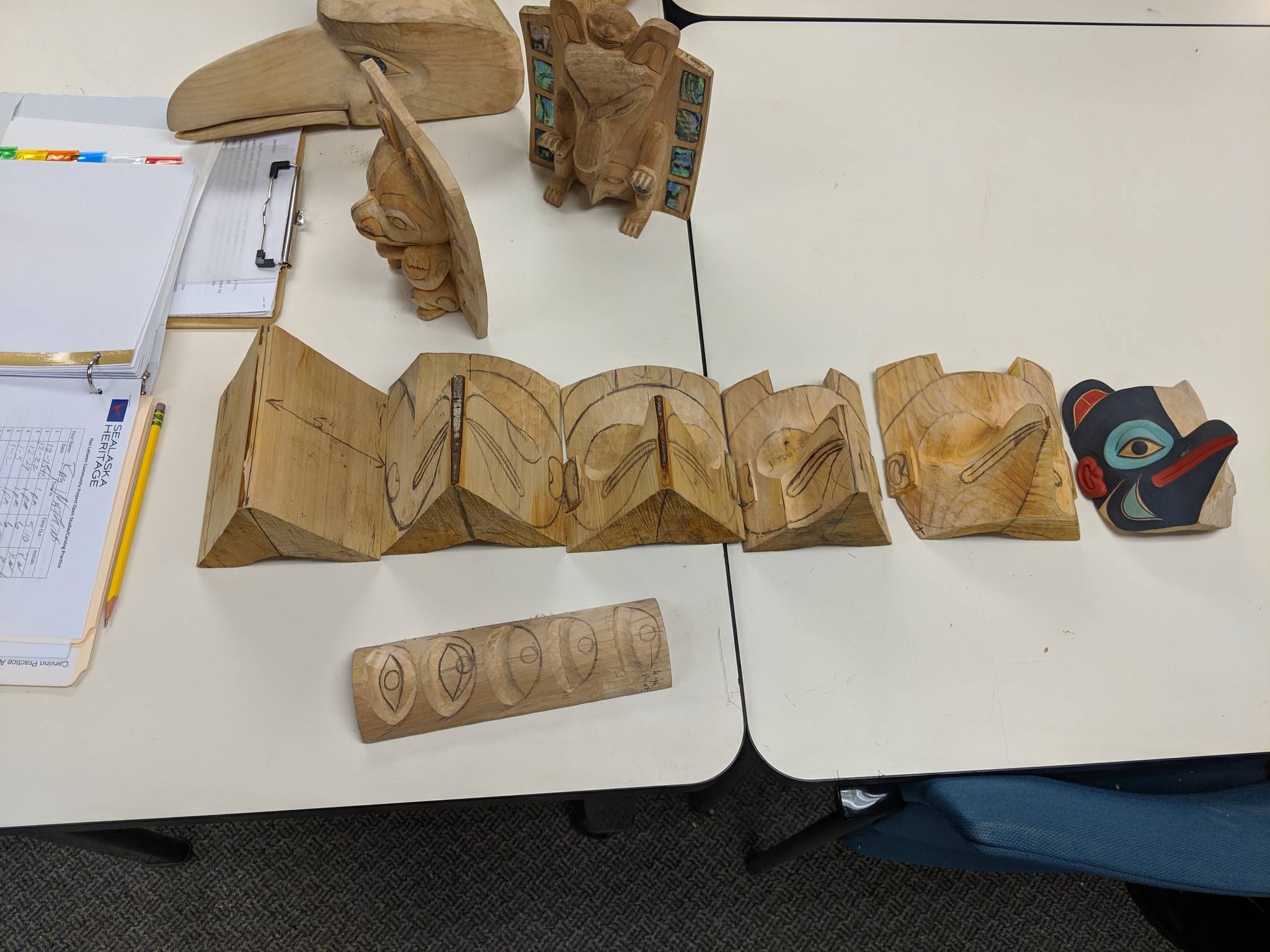 Ray Watkins uses models when he teaches carving classes. The models were present for carving practice, Saturday, Jan. 12, 2019. The practices are offered through Sealaska Heritage Institute. (Ben Hohenstatt | Capital City Weekly)