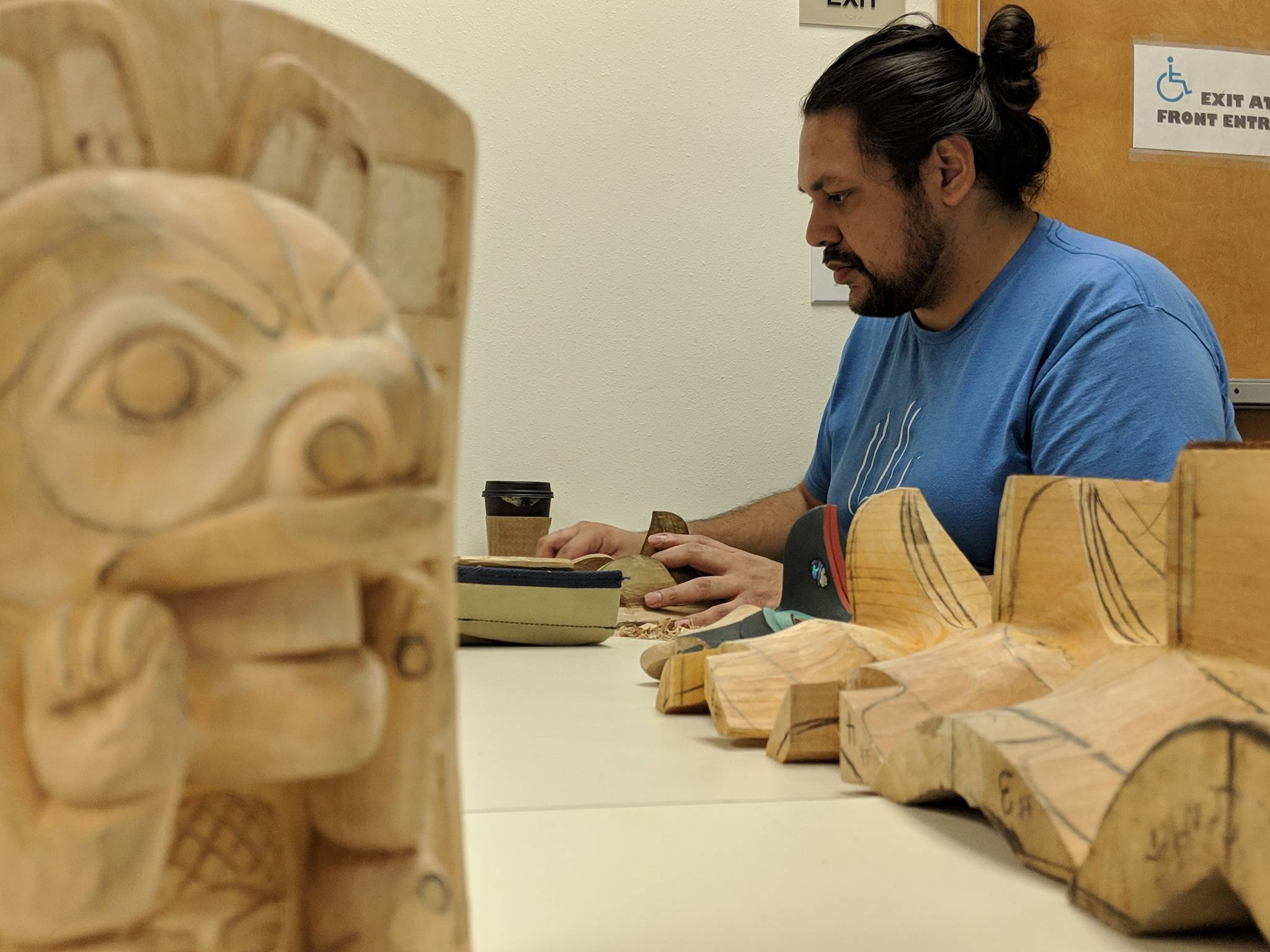 Too<span id=">k</span></span> Gregory carves during Saturday carving practice Saturday, Jan. 12, 2019. The practices are sponsored Sealaska Heritage Institute and facilitated by Gregory’s uncle, Donald Gregory. (Ben Hohenstatt | Capital City Weekly)