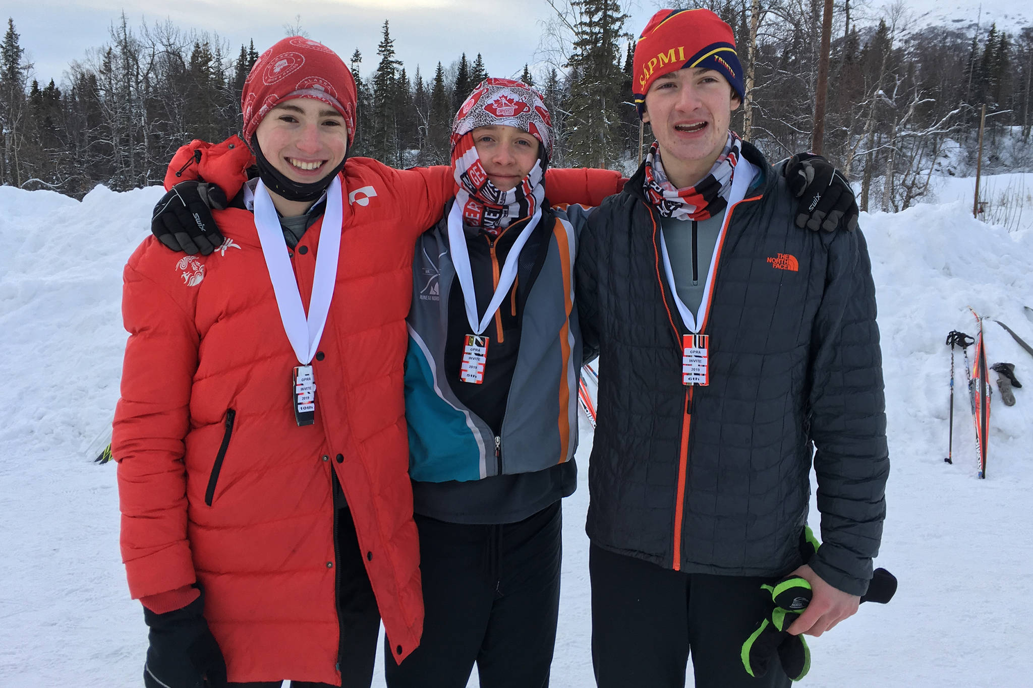 Juneau Nordic Ski Team members (from left) Finn Morley, Arne Ellefson-Carnes and Clem Taylor-Roth pose for a photo after earning medals for their top-10 finishes at the Government Peak Recreation Area Invitational in Palmer on Saturday. Awards were given to the top-10 skiers based on the cumulative time of a 5-kilometer interval-start freestyle race on Friday and 5-kilometer mass-start classic race on Saturday. Ellefson-Carnes finished fifth, Taylor-Roth sixth and Morley 10th. (Courtesy Photo | Merry Ellefson)