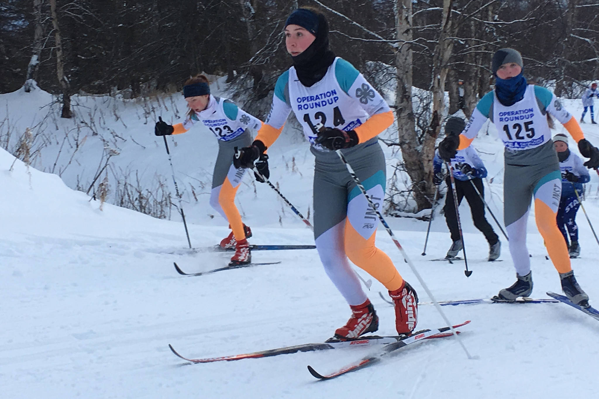 The Juneau Nordic Ski Team’s Katie McKenna leads Annika Schwartz, left, and Linnea Lentfer up a hill during the 5-kilometer high school girls mass-start classic race during the second day of the Government Peak Recreation Area Invitational in Palmer on Saturday. McKenna took 21st with a time of 24 minutes, 19.2 seconds. Schwartz placed 22nd and Lentfer placed 27th. Anna Iverson (25th), Melia Lu Trousil (28th) and Lindsay McTague (20th) also competed in the race for Juneau. (Courtesy Photo | Merry Ellefson)