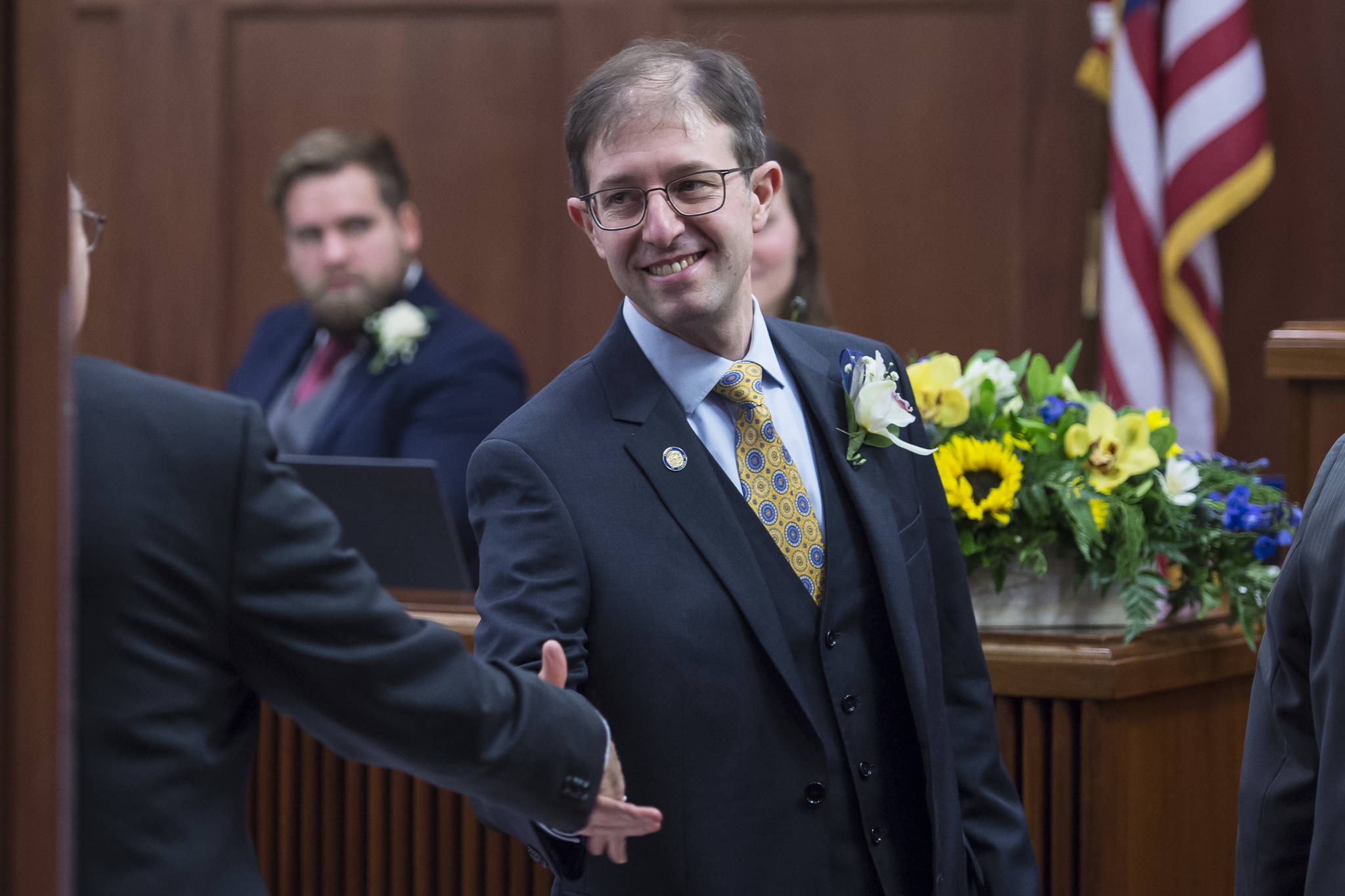 Sen. Jesse Kiehl is congratulated after being sworn in on the opening day of the 31st Session of the Alaska Legislature on Tuesday, Jan. 15, 2019. (Michael Penn | Juneau Empire)