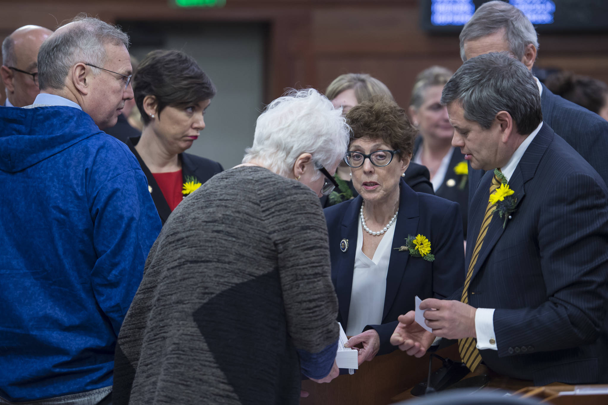 Democratic legislators huddle on the opening day of the 31st Session of the Alaska Legislature on Tuesday, Jan. 15, 2019. (Michael Penn | Juneau Empire)