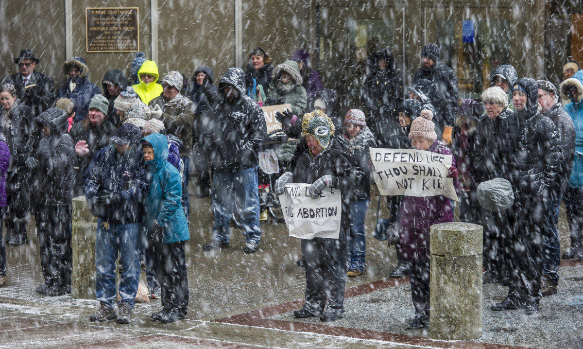About 100 people attend the Rally for Life last year during a snow squall in front of the Capitol. (Michael Penn | Juneau Empire File)