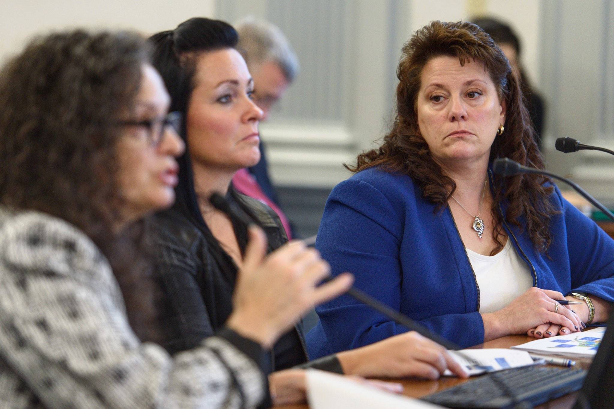 Corri Feige, Commissioner of the Department of Natural Resources, right, listens to Chantal Walsh, director of the Division of Oil and Gas, left, as along with Sara Longan, Deputy Commissioner of DNR, center, give a status of North Slope production during a Senate Finance Committee meeting on Thursday, Jan. 17, 2019. (Michael Penn | Juneau Empire)