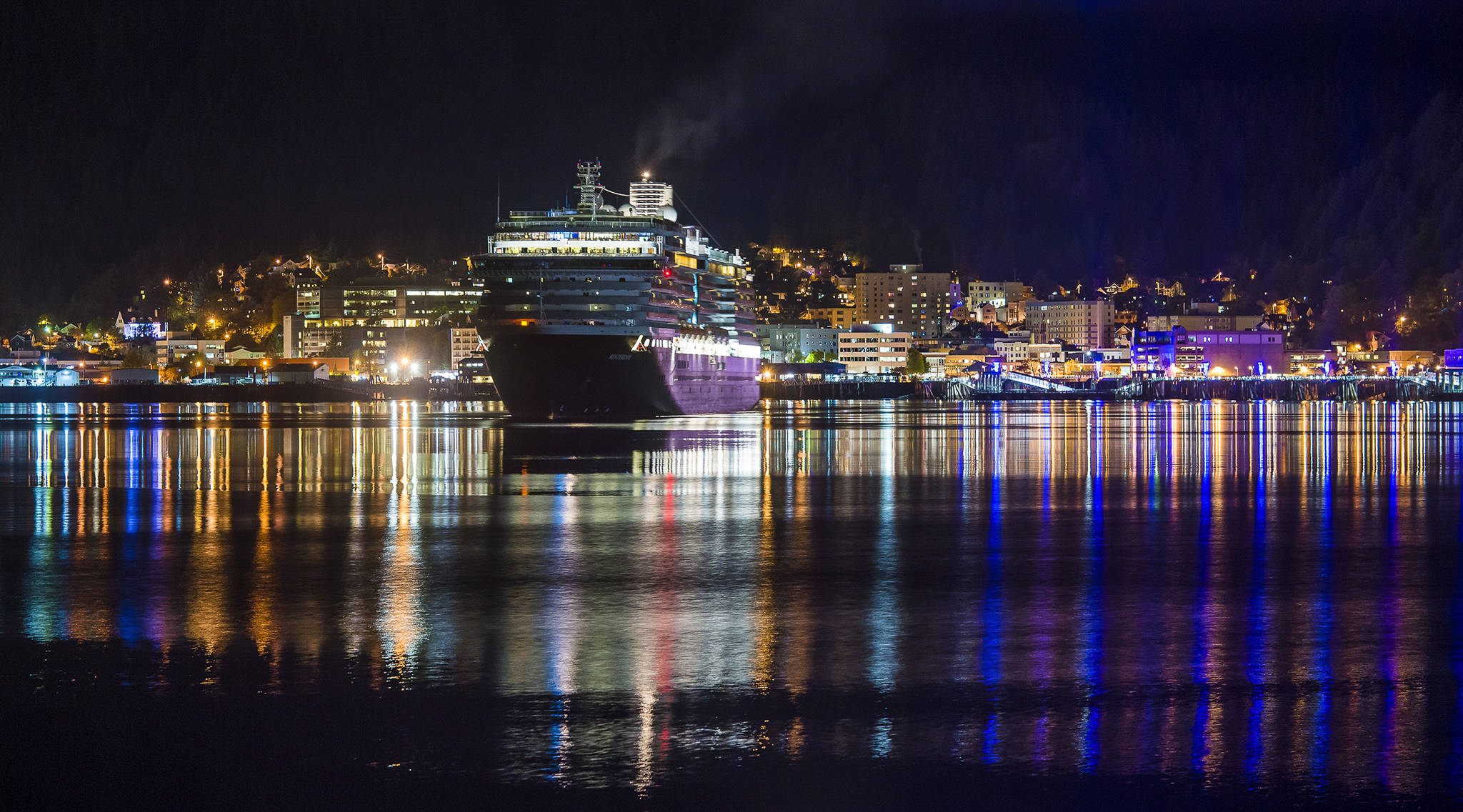 The Holland America Line cruise ship Westerdam slips out of Juneau’s downtown harbor just before 11 p.m. on Tuesday, Oct. 2, 2018. The Norwegian Pearl also visited Tuesday, the last day of the season. (Michael Penn | Juneau Empire)