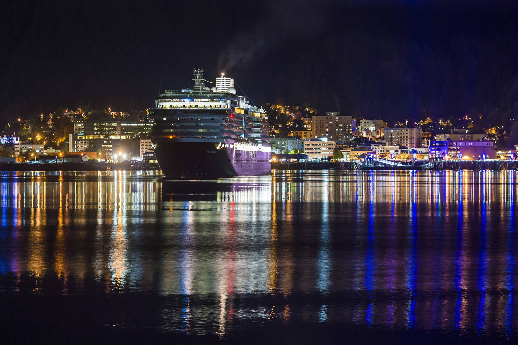 The Holland America Line cruise ship Westerdam slips out of Juneau’s downtown harbor just before 11 p.m. on Tuesday, Oct. 2, 2018. The Norwegian Pearl also visited Tuesday, the last day of the season. (Michael Penn | Juneau Empire)
