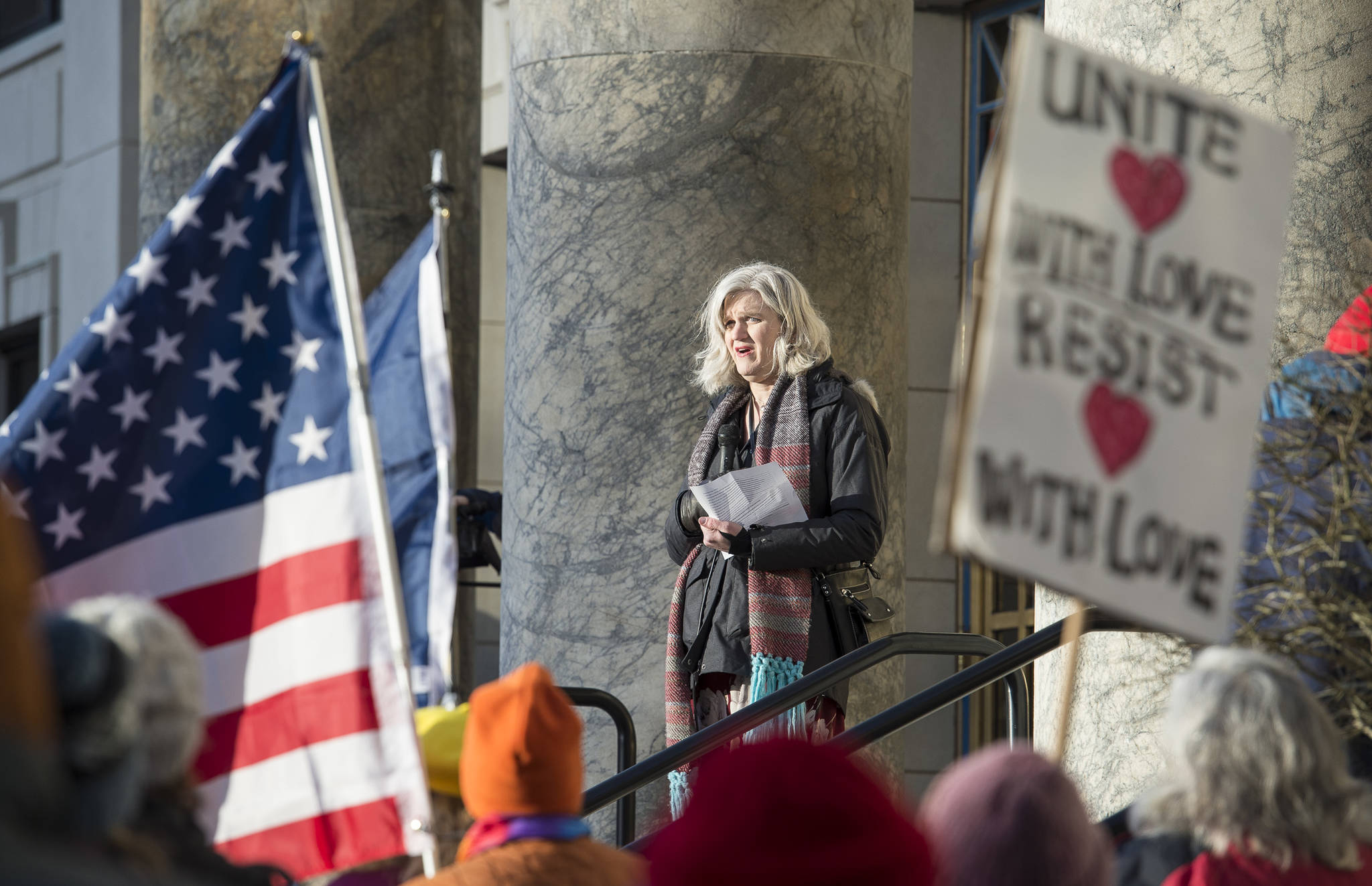 Allison Caputo speaks at the Women’s March on Juneau in front of the Alaska State Capitol on Saturday, Jan. 19, 2019. (Michael Penn | Juneau Empire)