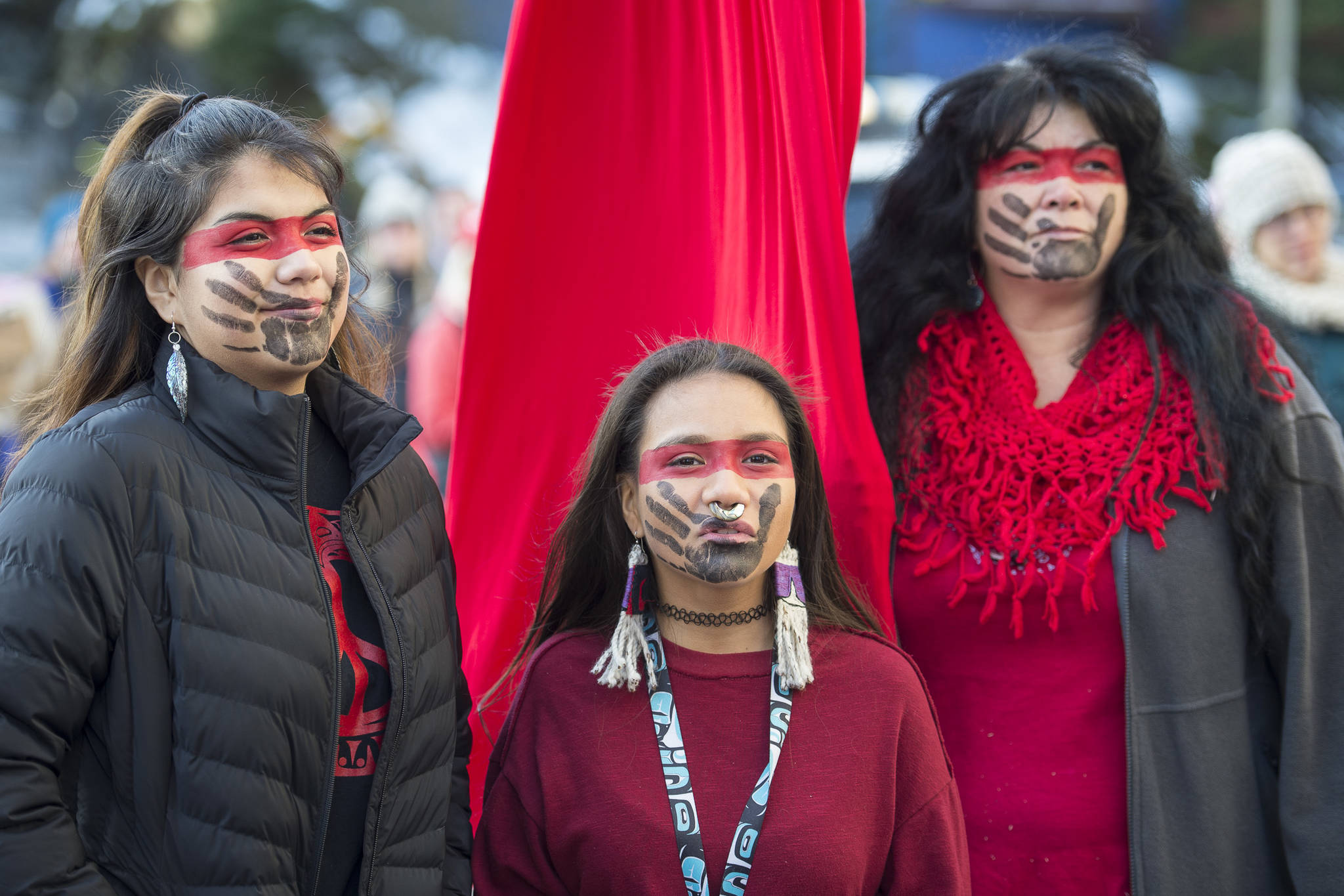 Susan Brouillette, right, with her daughters, Sierra, center, and Kendra, attend the Women’s March on Juneau in front of the Alaska State Capitol on Saturday, Jan. 19, 2019. (Michael Penn | Juneau Empire)