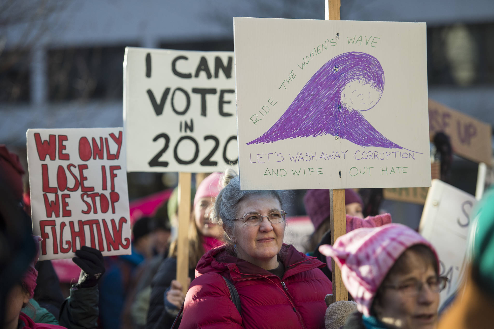 City and Borough of Juneau Assembly member Michelle Bonnet Hale holds a sign at the Women’s March on Juneau in front of the Alaska State Capitol on Saturday, Jan. 19, 2019. (Michael Penn | Juneau Empire)