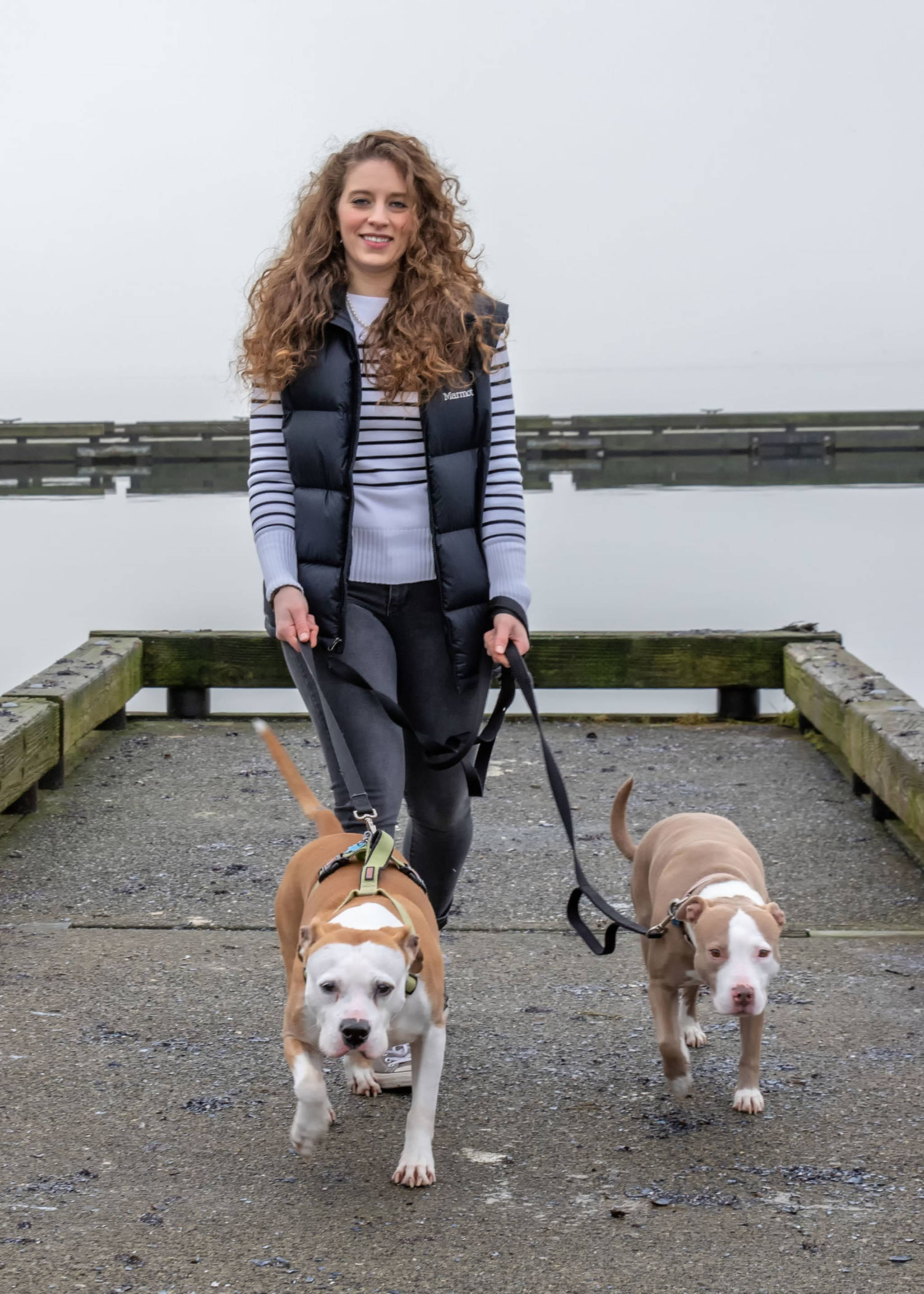 Feb. 10, 2019: No matter what the weather, dogs always need to be walked. You might as well do it in style! On this foggy day, Alicia Harris chose classic standards for her outing with her dogs Cooper and Diamond: a black and white striped J.Crew sweater, Levi’s jeans, Converse sneakers and a black Marmot vest for warmth. And, regardless of her outfit or the occasion, Alicia always wears her signature string of pearls.