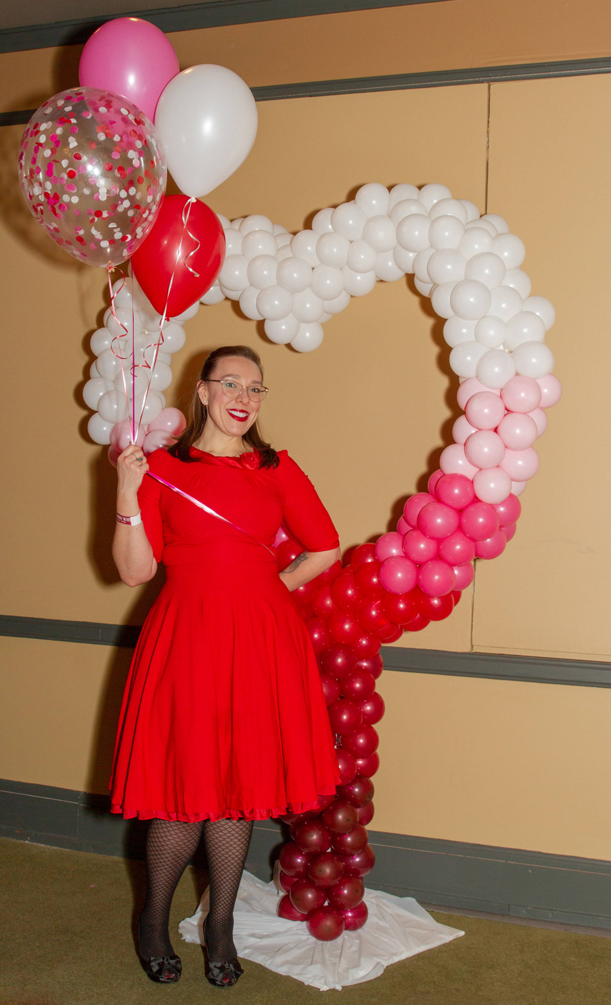 Feb. 17, 2019: Amy Paige knows that vintage fashion is always in style! For a recent night on the town, at a fundraising event for Juneau Animal Rescue, she wore “the perfect red dress” — a bright 1950s style swing dress with crinoline slips underneath. Simply add black fishnet stockings and heels from Shoefly, and red lipstick, and she was good to go!