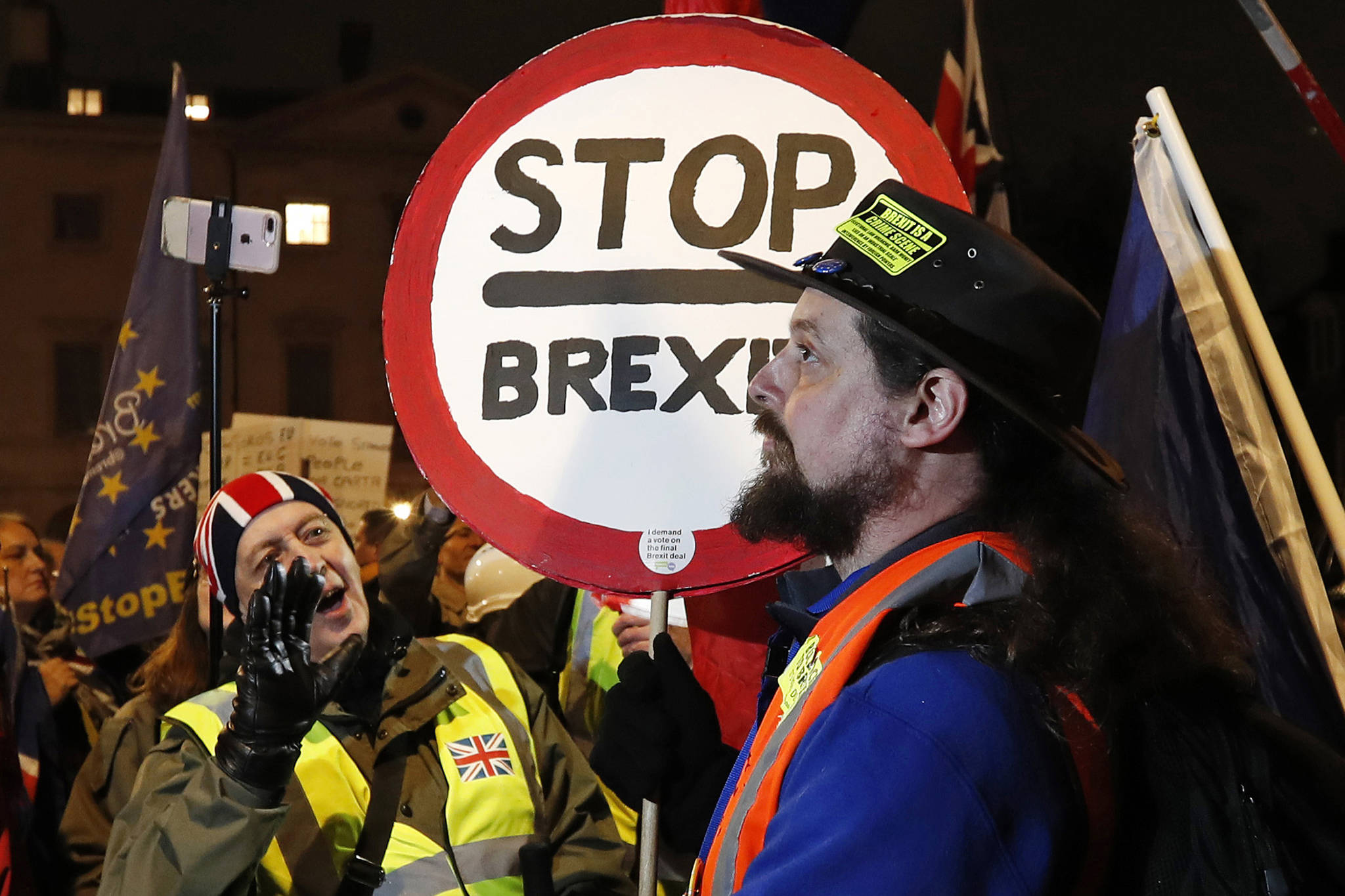 A pro-Brexit supporter, left, gestures at a remain supporter near the Parliament in London on Jan. 29, 2019. (Alastair Grant | Associated Press)