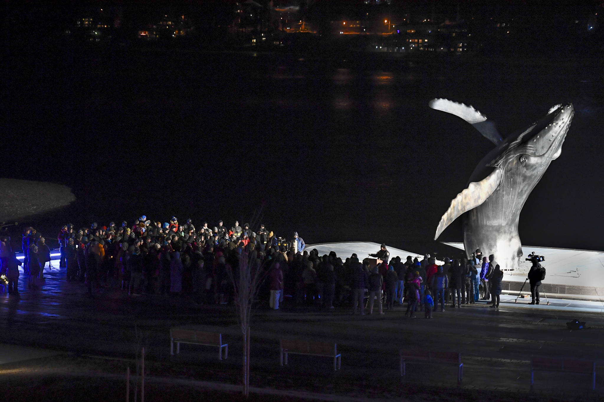 Hundreds of Juneau residents turnout Friday, Feb. 1, 2019, in 8F degree weather for a candlelight vigil at Mayor Bill Overstreet Park for the Guardian medical flight crew that went missing this week. (Michael Penn | Juneau Empire)