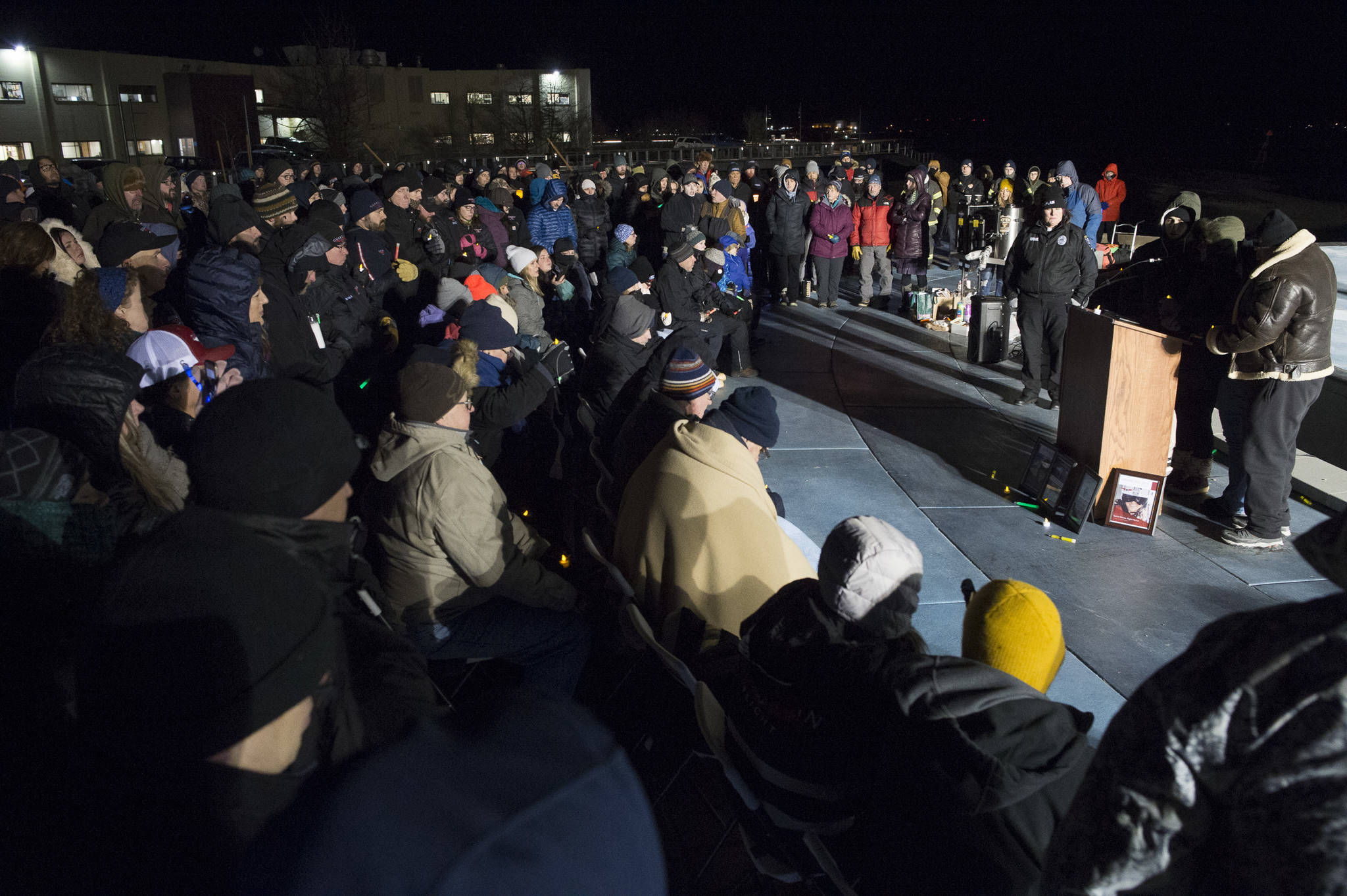 Hundreds of Juneau residents turnout Friday, Feb. 1, 2019, in 8-degree weather for a candlelight vigil at Mayor Bill Overstreet Park for the Guardian medical flight crew that went missing this week. (Michael Penn | Juneau Empire)