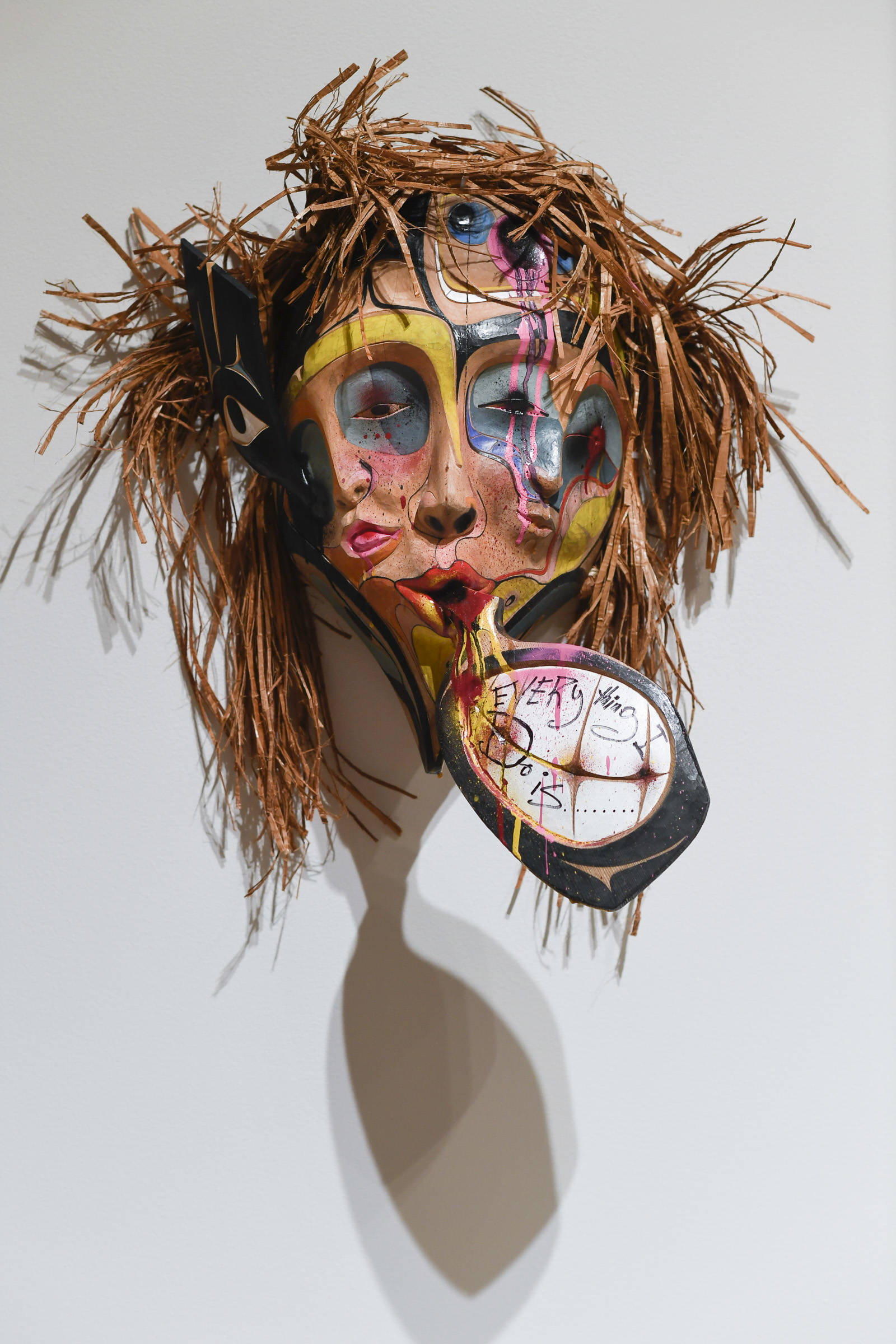Donald Varnell mask titled “Xuux” is made of red and yellow cedar, alder, spray paint, acrylic, watercolor, red cedar bark, zip ties and wood glue is on display at the Alaska State Museum on Friday, Feb. 1, 2019. (Michael Penn | Juneau Empire)