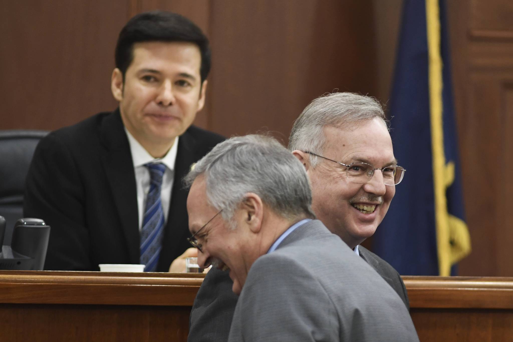 Former Speaker of the House Rep. Bryce Edgmon, D-Dillingham, right, shares a laugh with Speaker nominee Rep. David Talerico, R-Healy, at Speaker Pro Tempore Rep. Neal Foster, Nome, resides over the House on Monday, Feb. 4, 2019. The House continues in a stalemate to organize permanent leadership. (Michael Penn | Juneau Empire)