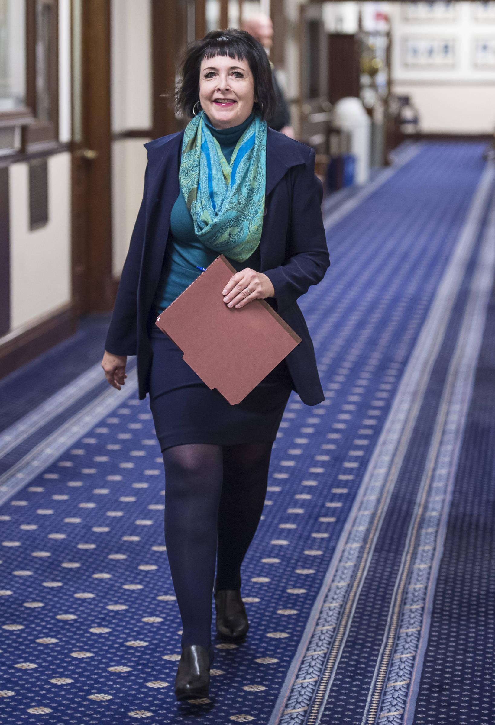 Sen. Shelley Hughes, R-Palmer, walks to attend Gov. Mike Dunleavy’s State of the State speech to a Joint Session of the Alaska Legislature on Tuesday, Jan. 22, 2019. (Michael Penn | Juneau Empire)