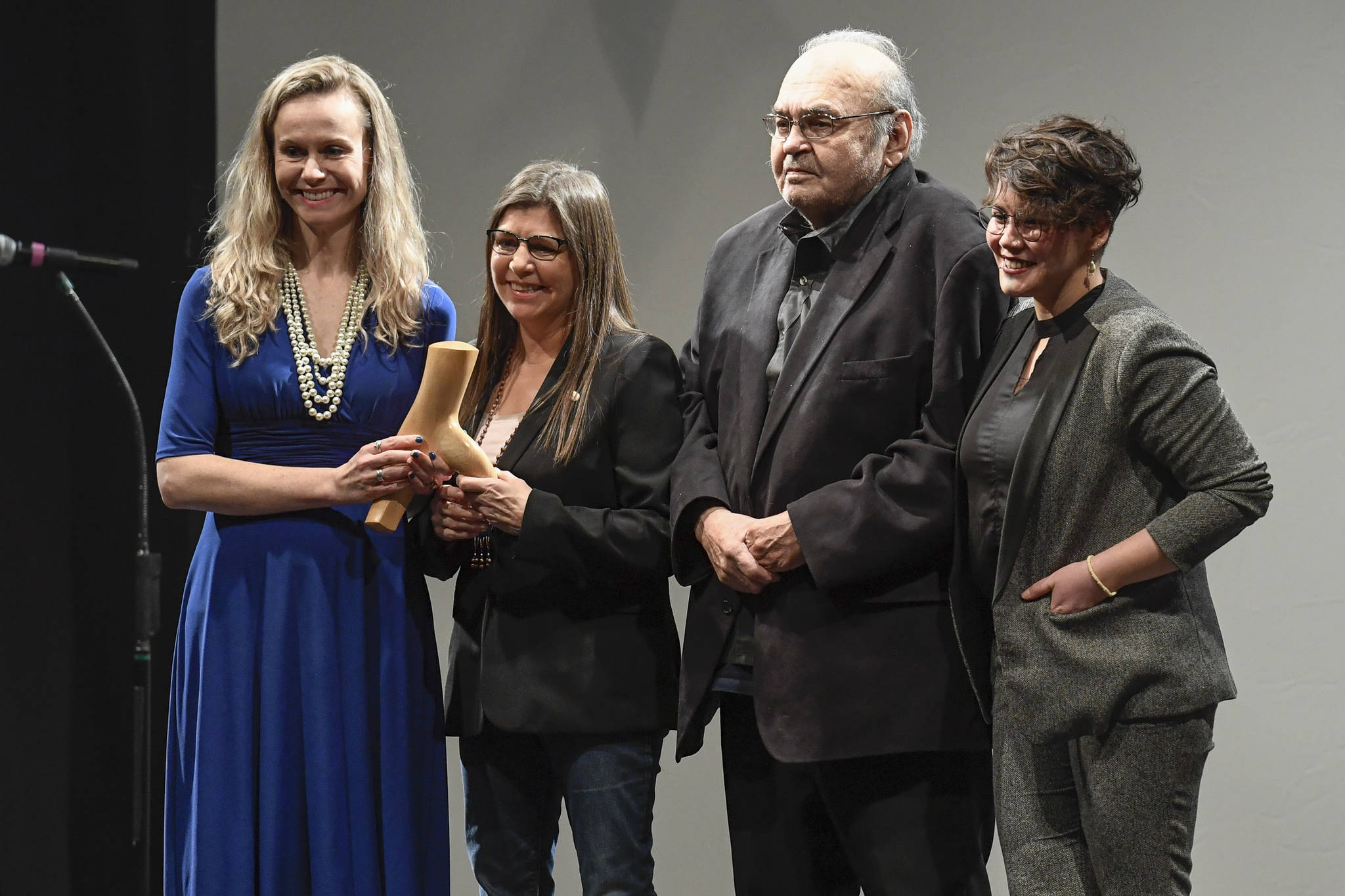 Members of the Chugach Regional Resources Commission, of Anchorage, receive their Distinguished Service to the Humanities Award for Education from Kelly Tshibaka, Commissioner of the Department of Administration, at the 2019 Governor’s Arts and Humanities Awards at the Juneau Arts & Culture Center on Thursday, Feb. 7, 2019. (Michael Penn | Juneau Empire)