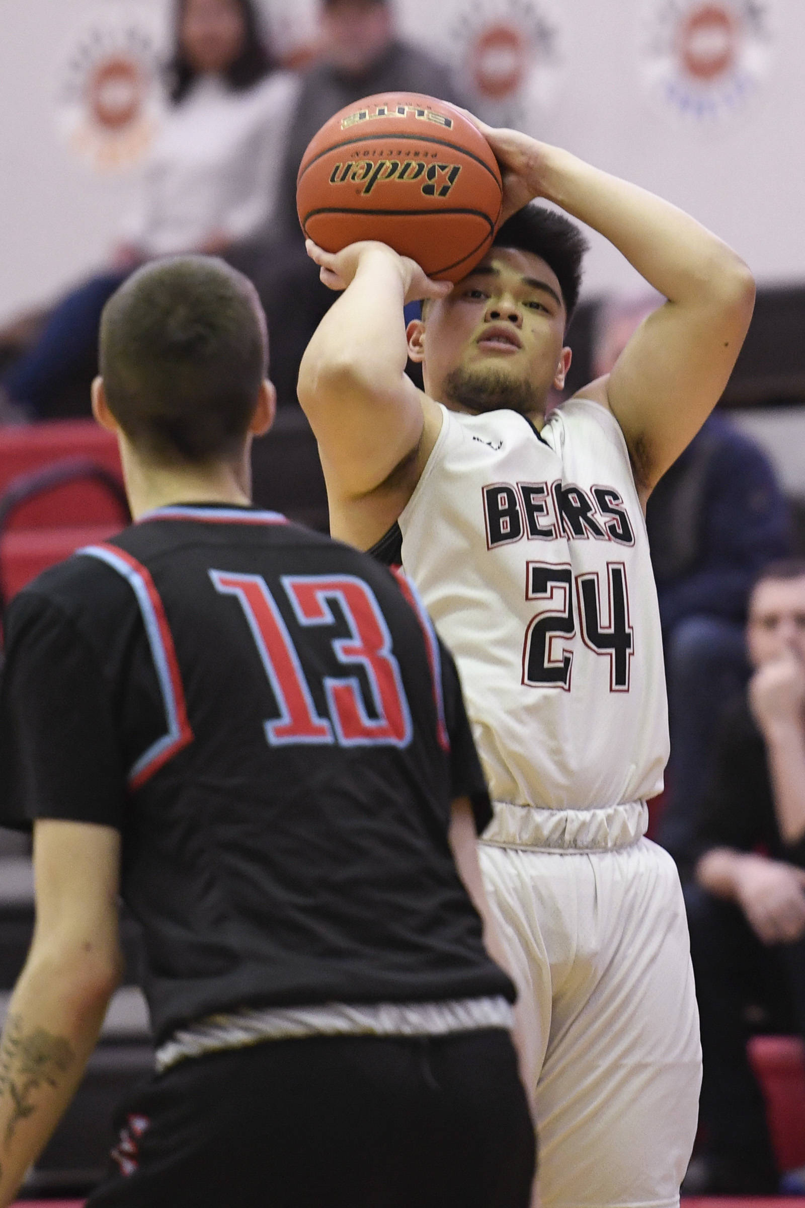 Juneau-Douglas’ Philip Gonzales shoots over East’s Andrew Graves at JDHS on Friday, Feb. 8, 2019. East won 66-54. (Michael Penn | Juneau Empire File)