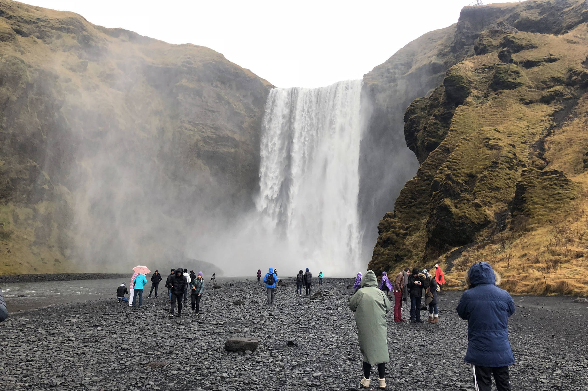 Tourists gather at a waterfall in Iceland, November 2018. (Emily Russo Miller | Juneau Empire)