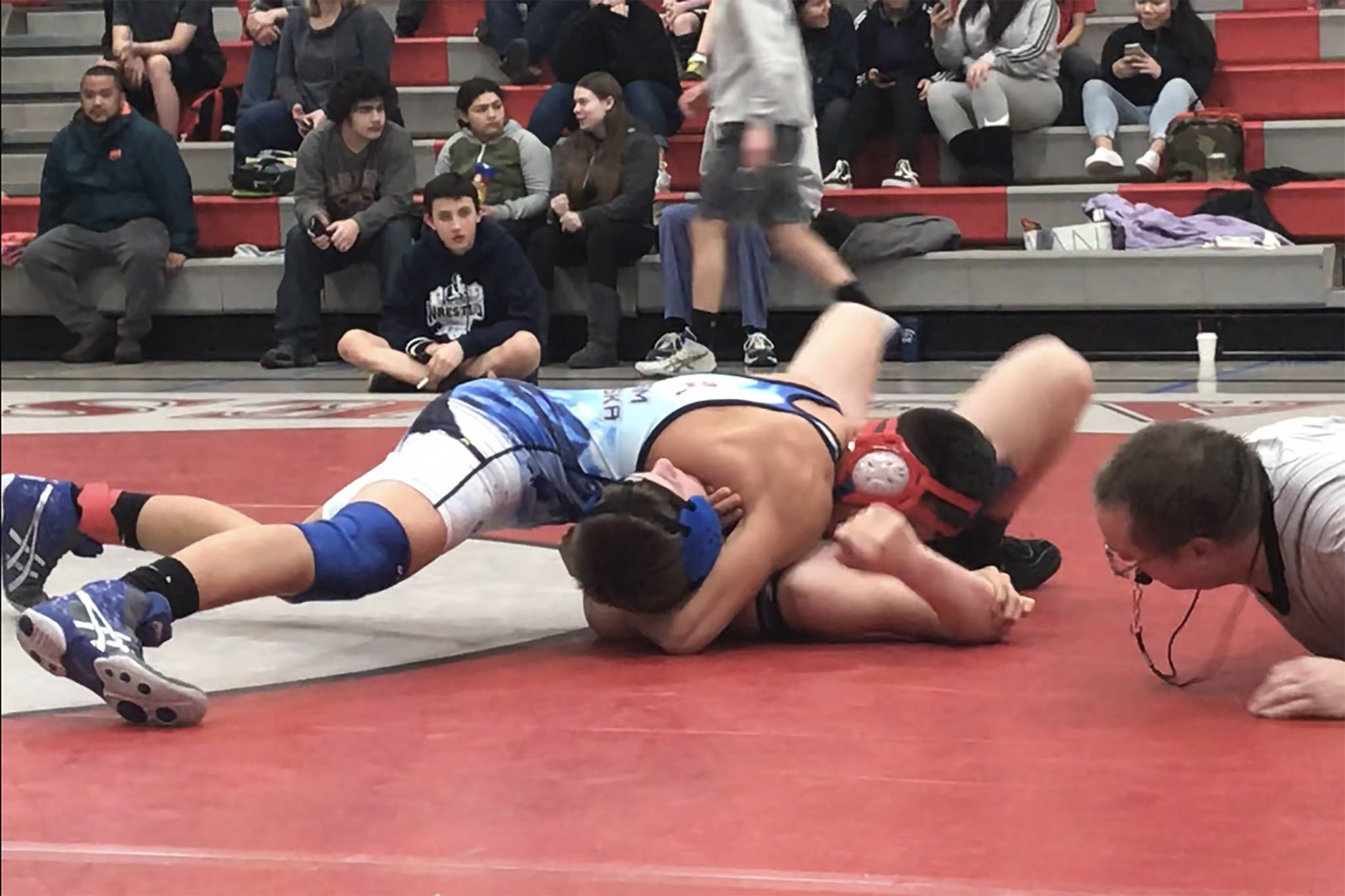 Dzantik’i Heeni Middle School’s Jamal Johnson wrestles in the 140-pound bracket at the Geoff Harben Invitational at FDMS. Johnson defeated Schoenbar Middle School’s Gavin Buendia in the finals to become one of seven Wolverines to reach the top of the podium. (Courtesy Photo | Angela Boyd)