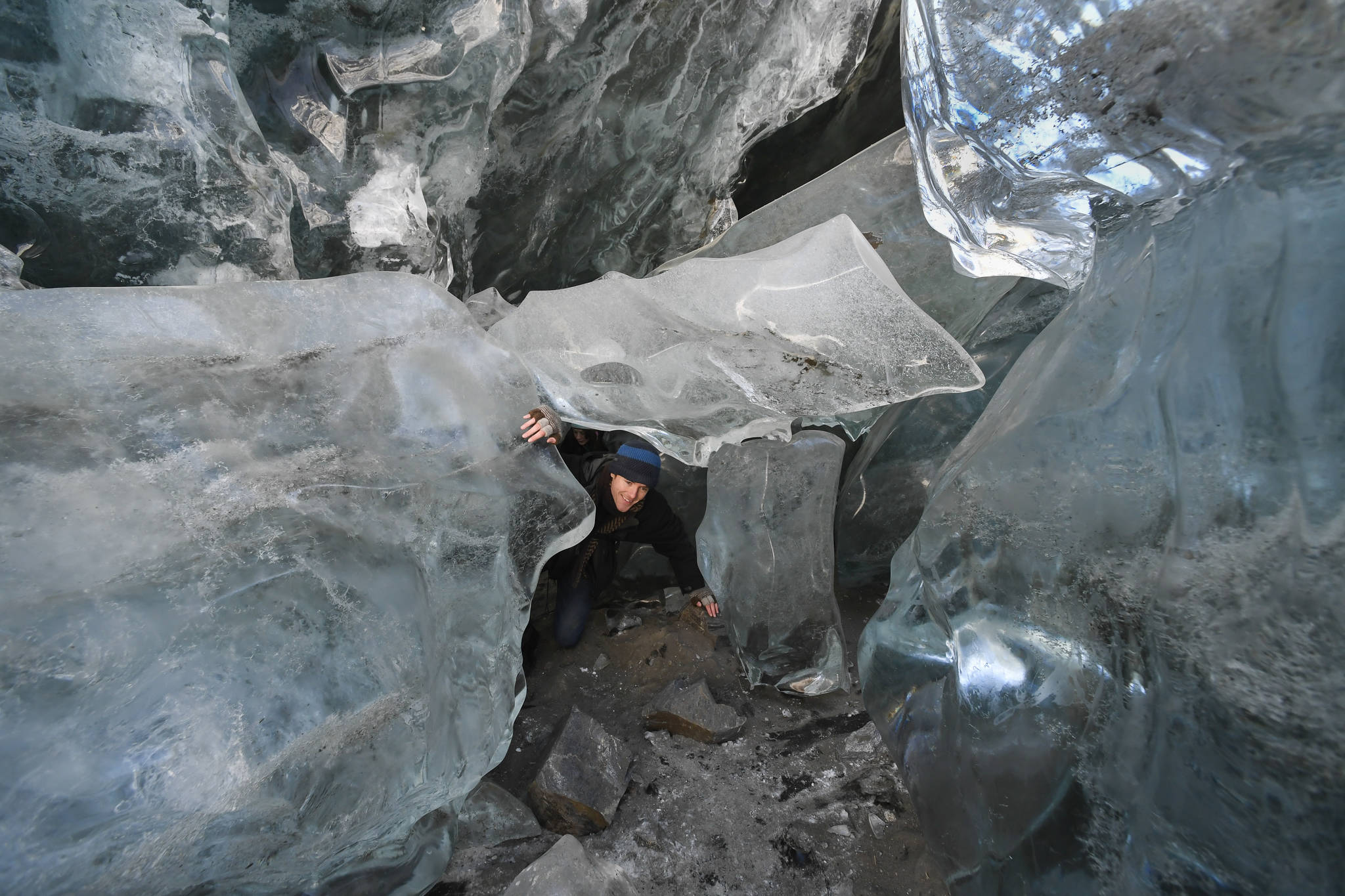 Salmon Thompson makes his way through a jumble of ice block at the entrance of an ice cave at the Mendenhall Glacier on Monday, Feb. 11, 2019. (Michael Penn | Juneau Empire)