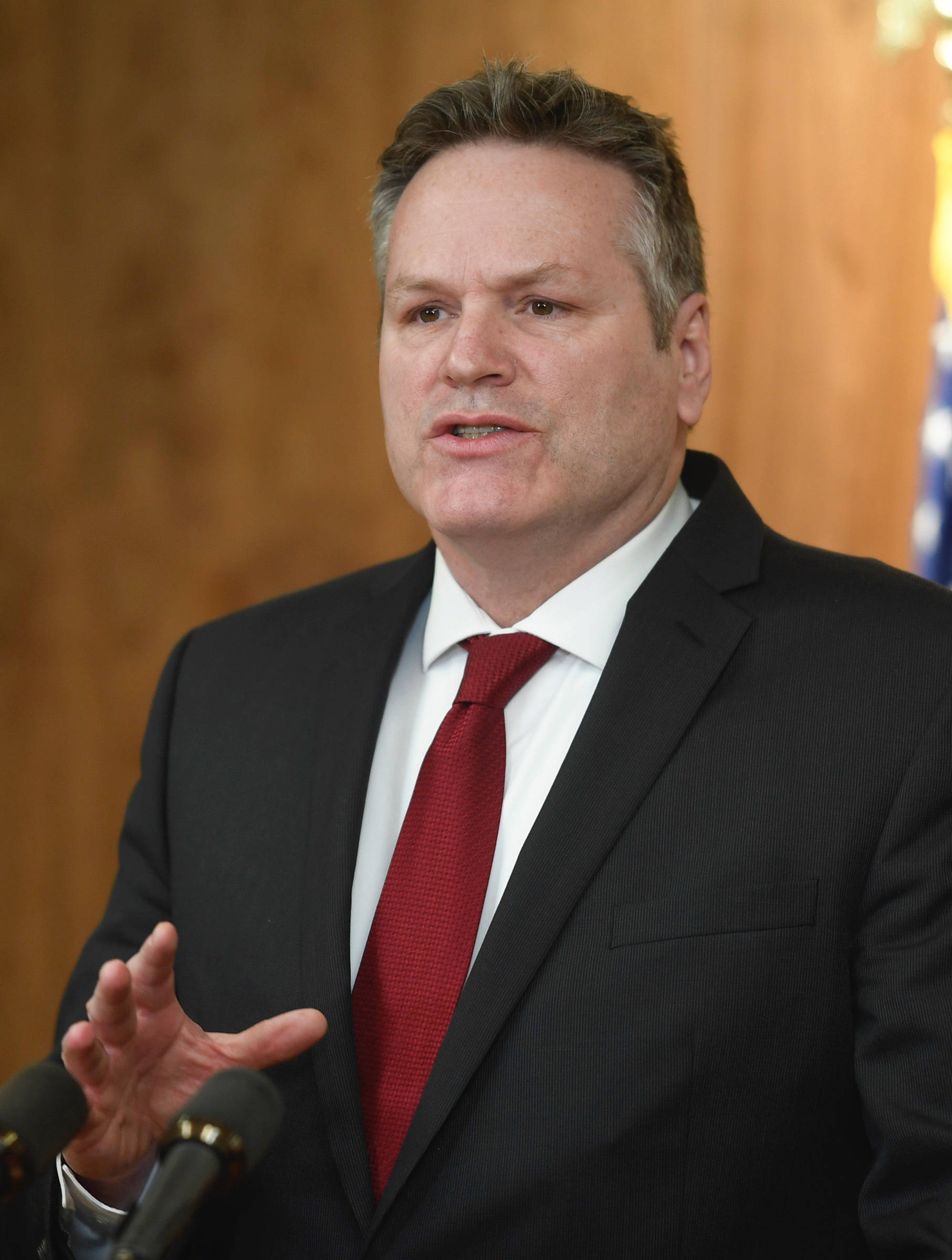 Gov. Mike Dunleavy announces his budget during a press conference to announce the state’s budget on Wednesday, Feb. 13, 2019. (Michael Penn | Juneau Empire)