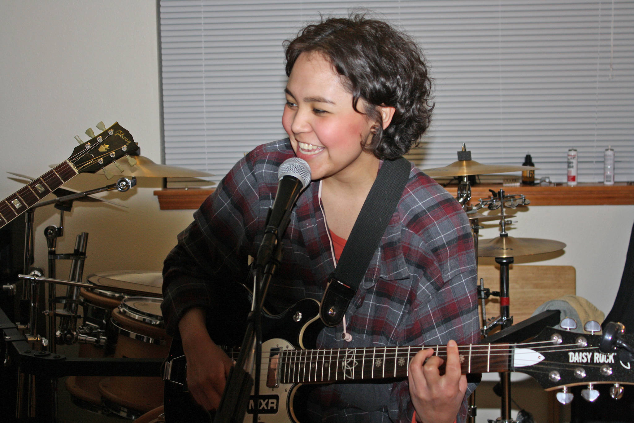 Daizy Floyd (AKA Keilani Friday) sings and plays guitar with her family’s band Garden of Agony on Wednesday, Feb. 13, 2019. (Ben Hohenenstatt | Capital City Weekly)